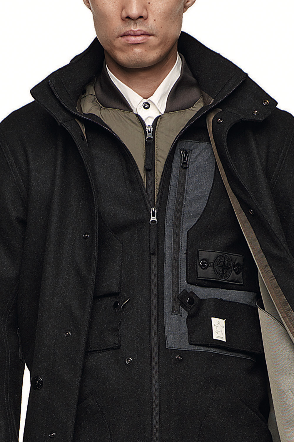 Completion moved inside a system designed to be refilled. Image Credit: Stone Island Shadow Project, Look 1, ’009–’010. Stealth Coat 7WZ9 (PROOF), Zip Shirt 1YZ8 (SKIN), Cargo Pant 3WZ1 (RESIST), Web Belt, Bagjack® Bag (EQUIP). Courtesy Stone Island.