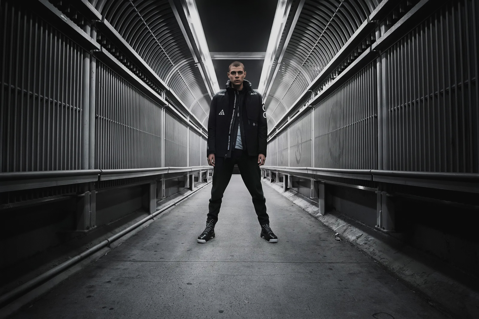 Architecture completes the category’s visual grammar before the garment is ever worn. Image Credit: NikeLab ACG campaign, 2014.