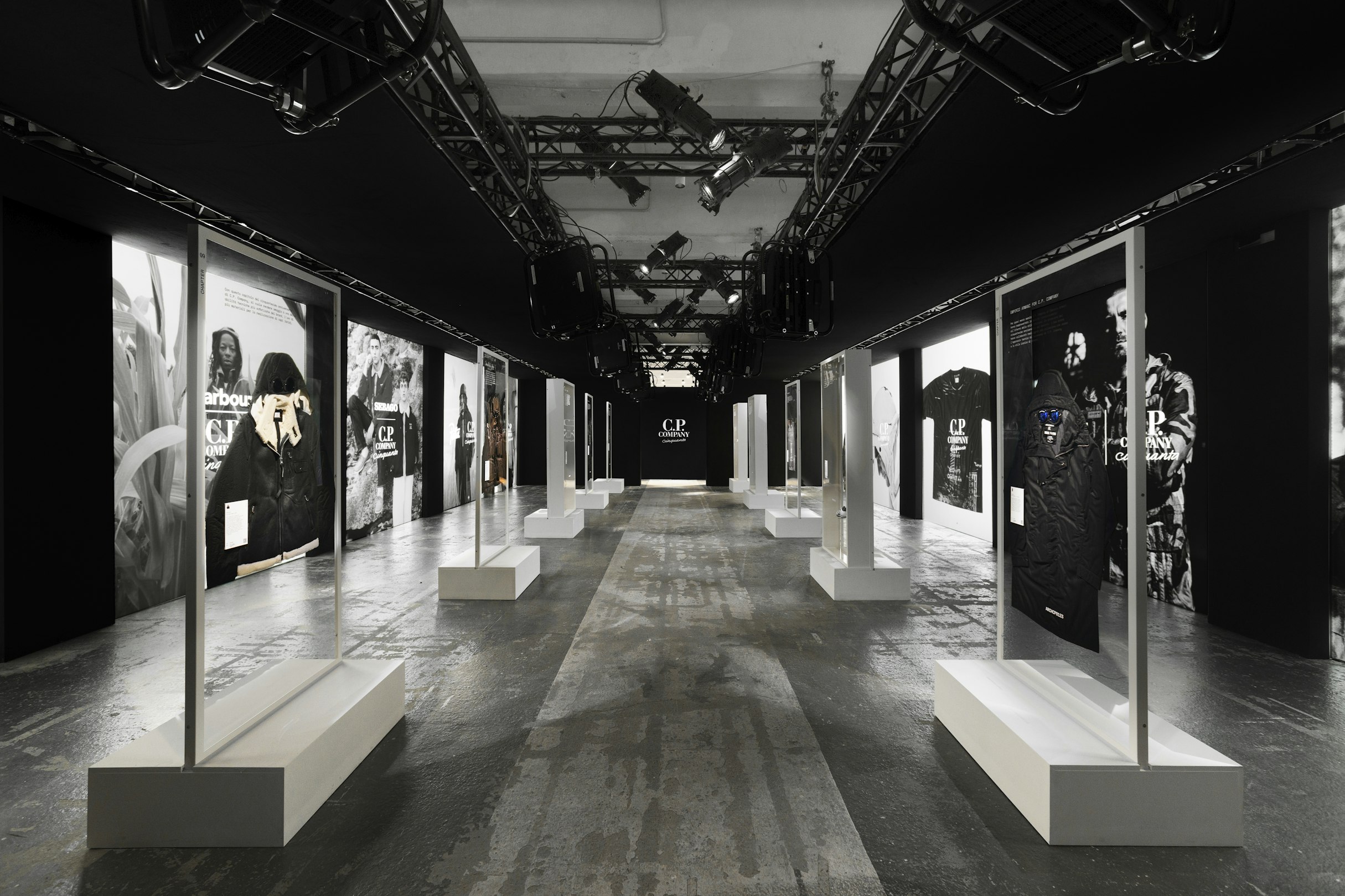 The anniversary exhibition transforms company history into a navigable environment rather than a chronological display. Image Credit: Cinquanta: A Retrospective on 50 Years of Sportswear Innovation by C.P. Company, BASE Milano, Milan, 2022.