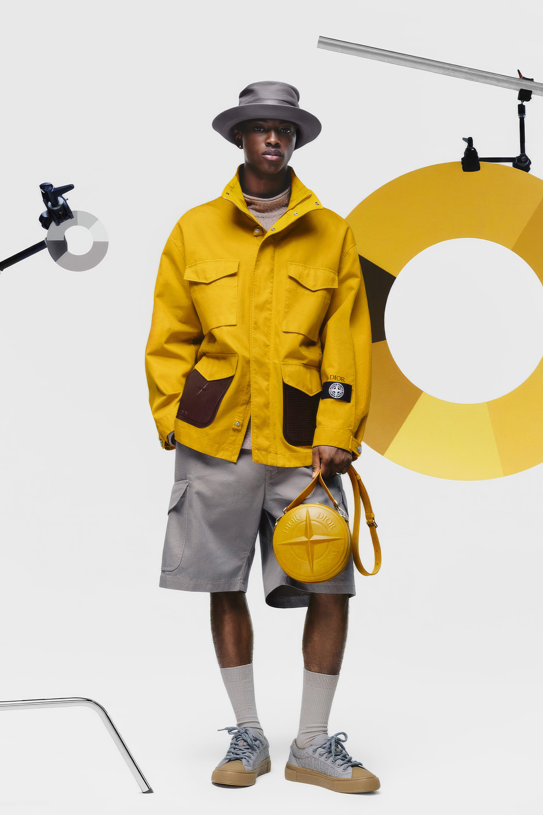 The collaboration preserves the field-jacket form while redistributing its materials and signs within inherited coordinates. Image Credit: Dior and Stone Island, Raso Gommato field jacket, Fall 2024.