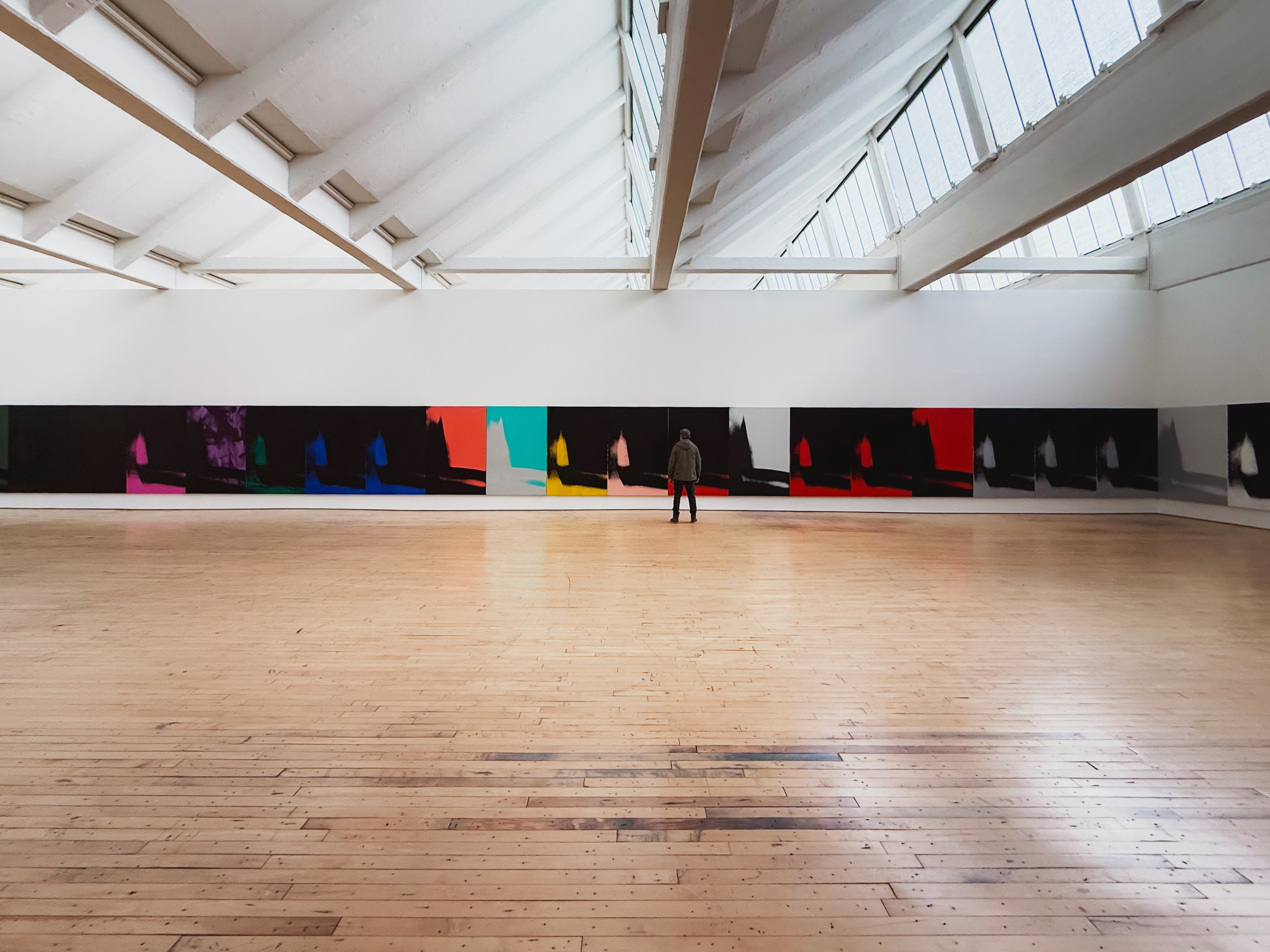 The individual panel remains legible while the work operates as a field. Image Credit: Andy Warhol, Shadows, 1978–79. Installation view, Dia Beacon.