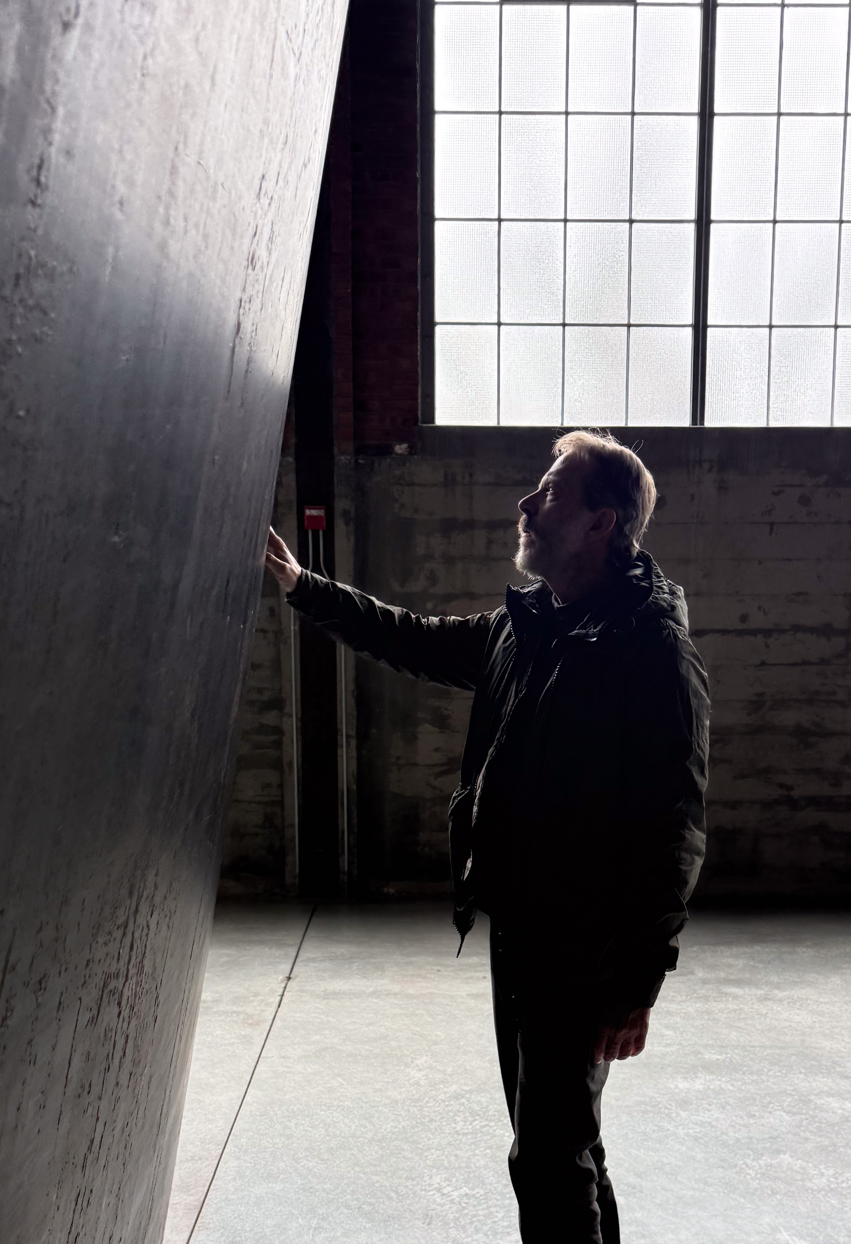 The hand reaches the work as soon as the work permits it. Image Credit: Fabio Cavina with Richard Serra. Installation view, Dia Beacon.