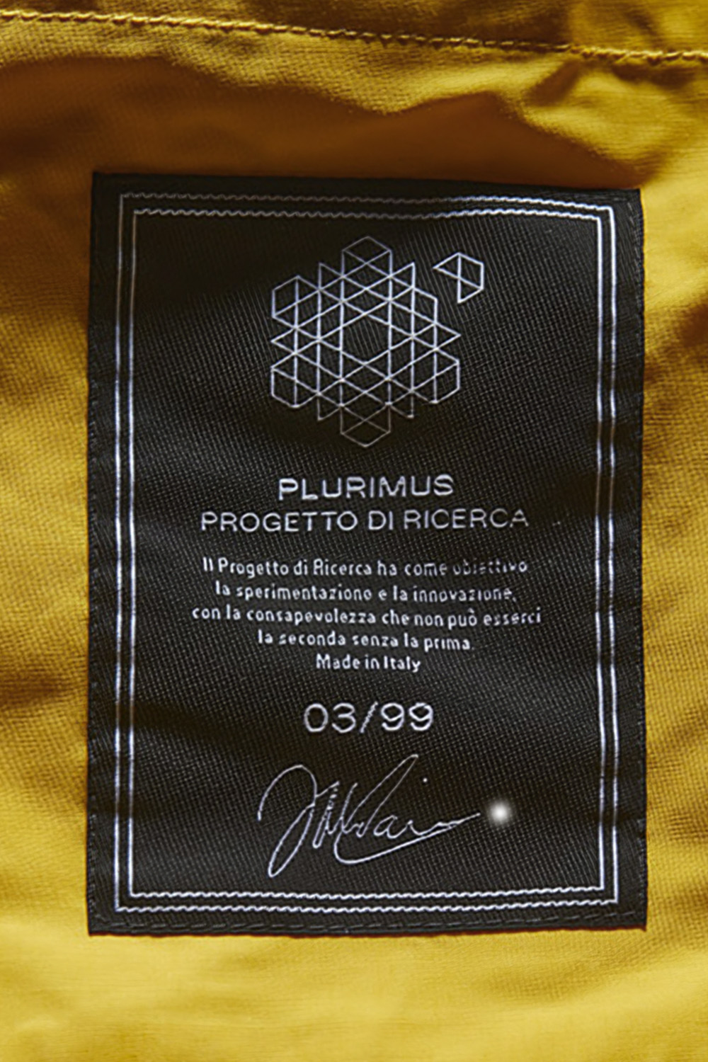 A numbered piece belongs to a relation conceived beyond the single garment. Image Credit: Plurimus numbered label, 03/99 (detail).