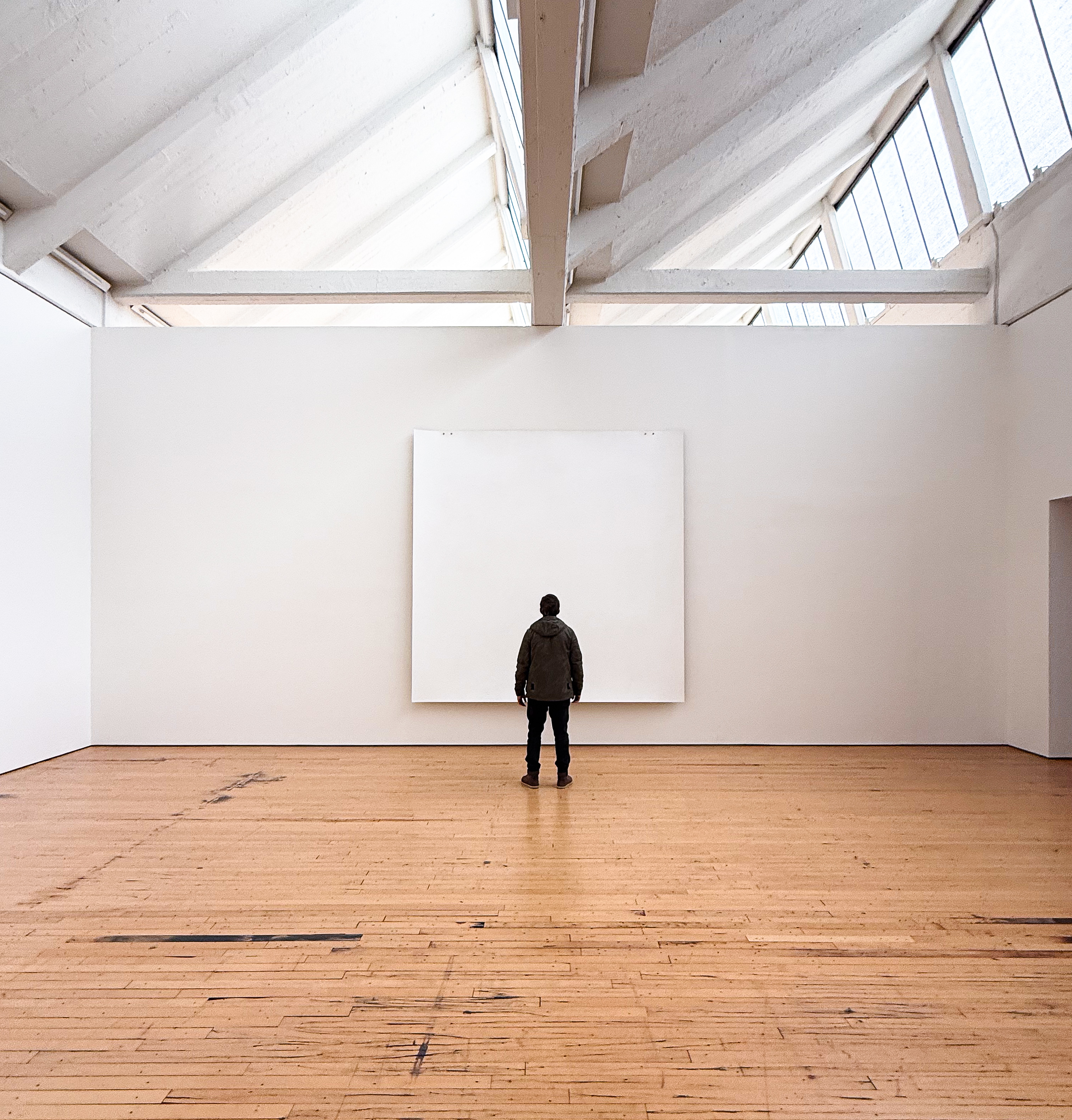Constraint held at the scale of a single surface. Image Credit: Robert Ryman. Installation view, Dia Beacon.