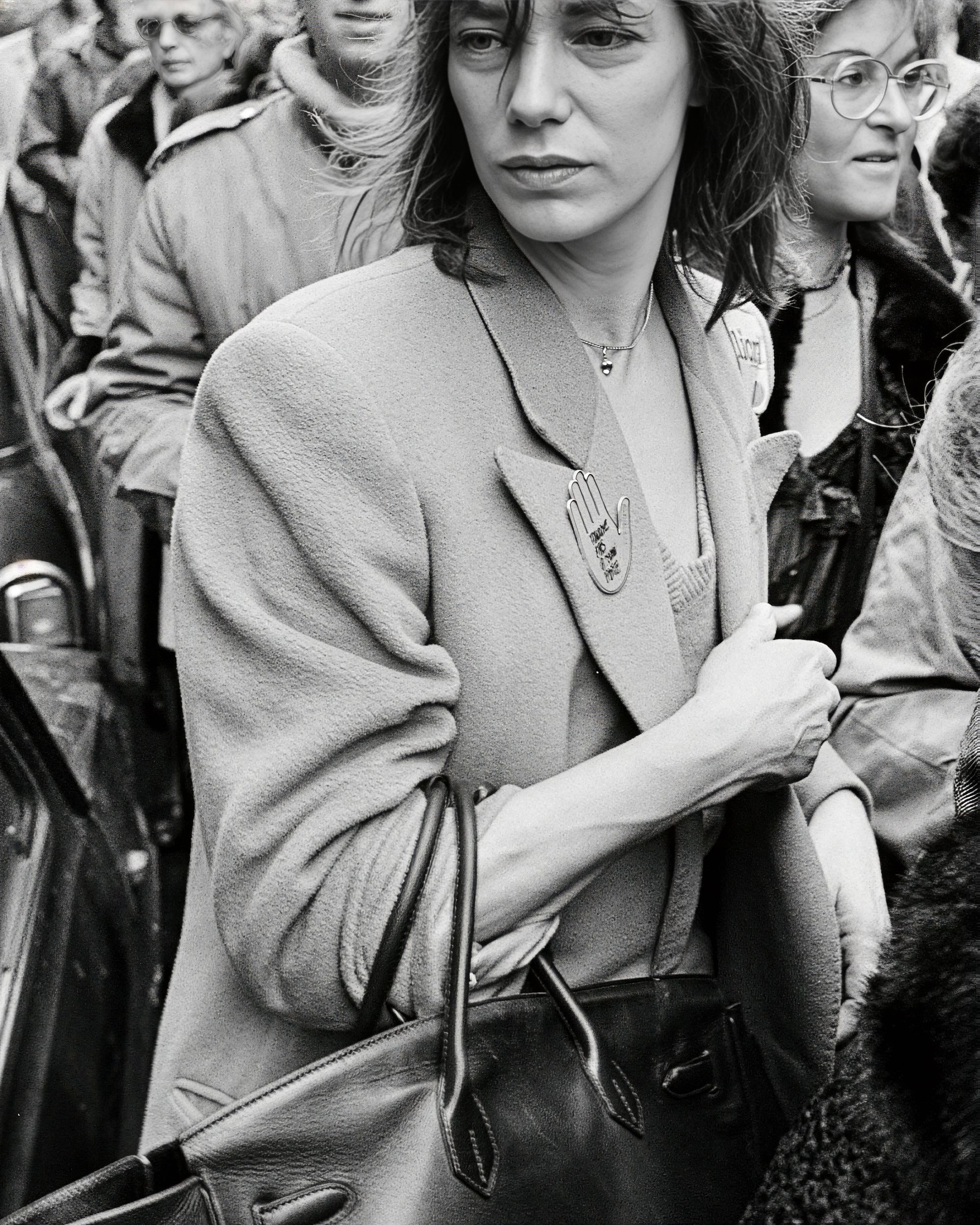 The origin image matters because the bag begins with a body, not a marketplace: use, movement, and public visibility before the object becomes asset. Image Credit: Jane Birkin archival photograph. Photo by Pierre Guillaud / AFP.