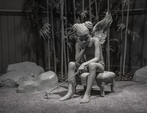 In New York in 2024, rocks, bamboo, darkness, and ground gathered around the same figure until object began to read as inhabitant. Image Credit: Hans Op de Beeck, Zhai-Liza (angel), 2024. Photo: Dominique Provost.