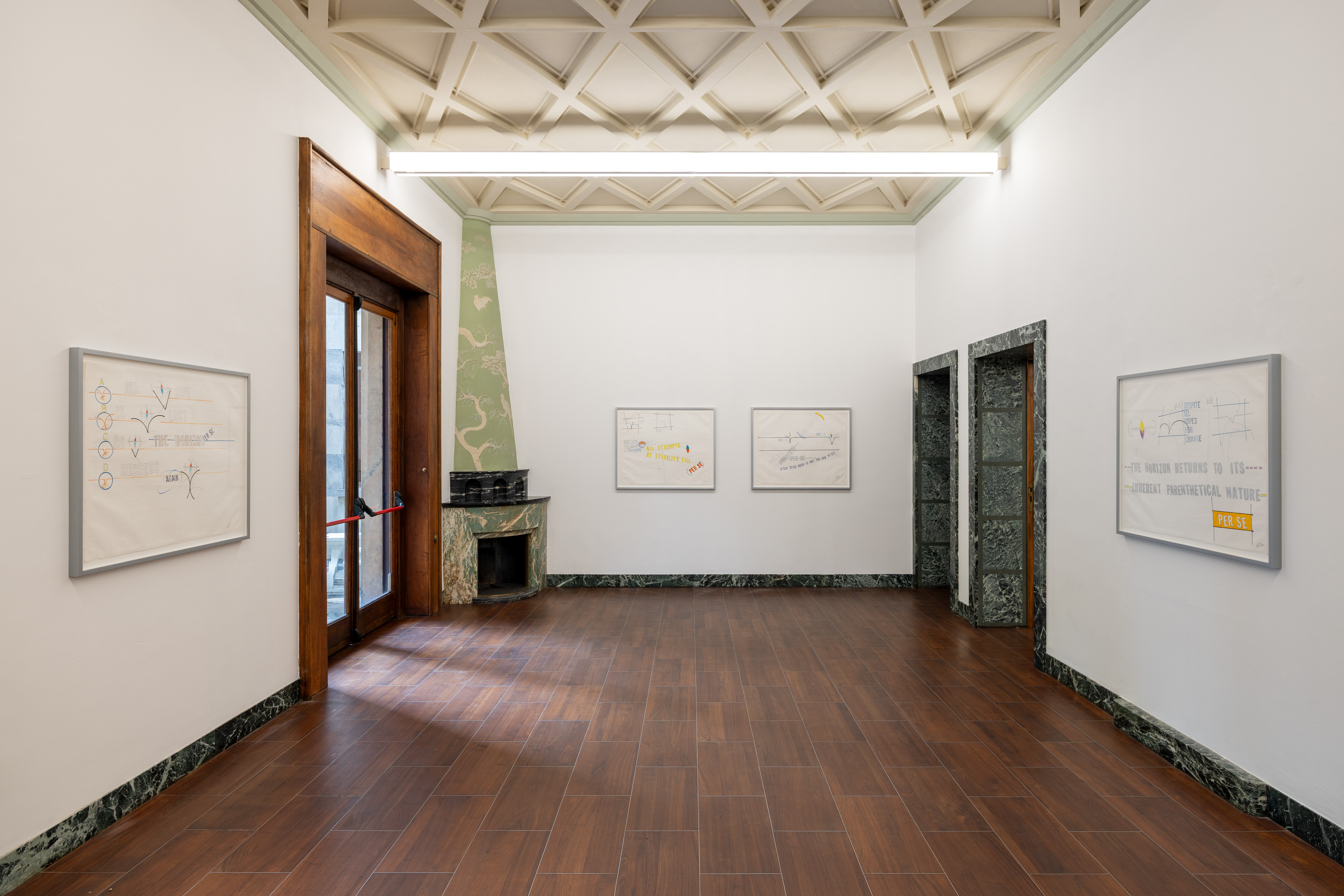 Four works on paper return repeatedly to horizontals, arcs, brackets, and the language of the horizon. Image Credit: Installation view. Courtesy of the Artist and MASSIMODECARLO. Photo: Roberto Marossi.