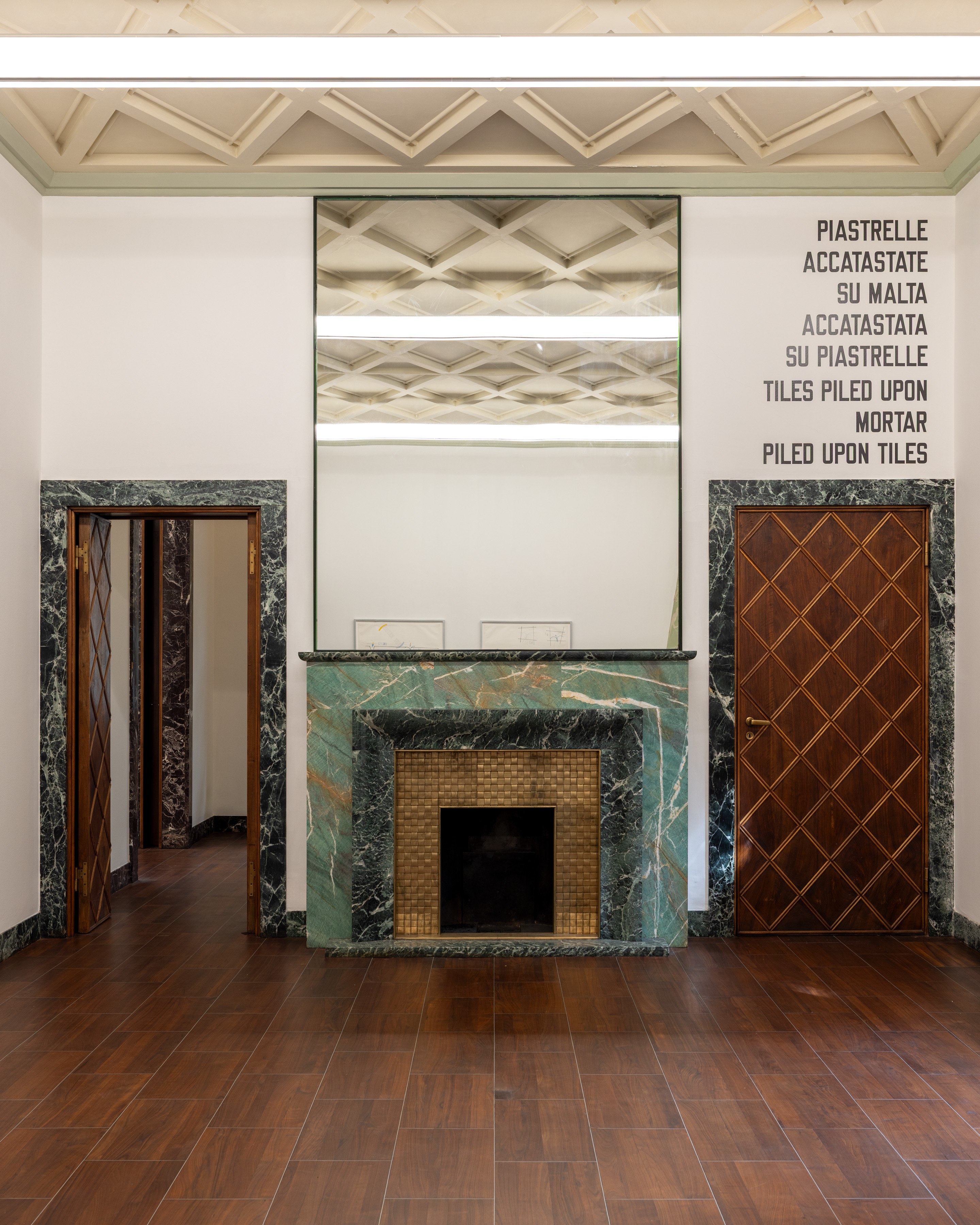 TILES is the quiet countercase: language alone, without an independent graphic mark. Image Credit: Installation view. Courtesy of the Artist and MASSIMODECARLO. Photo: Roberto Marossi.