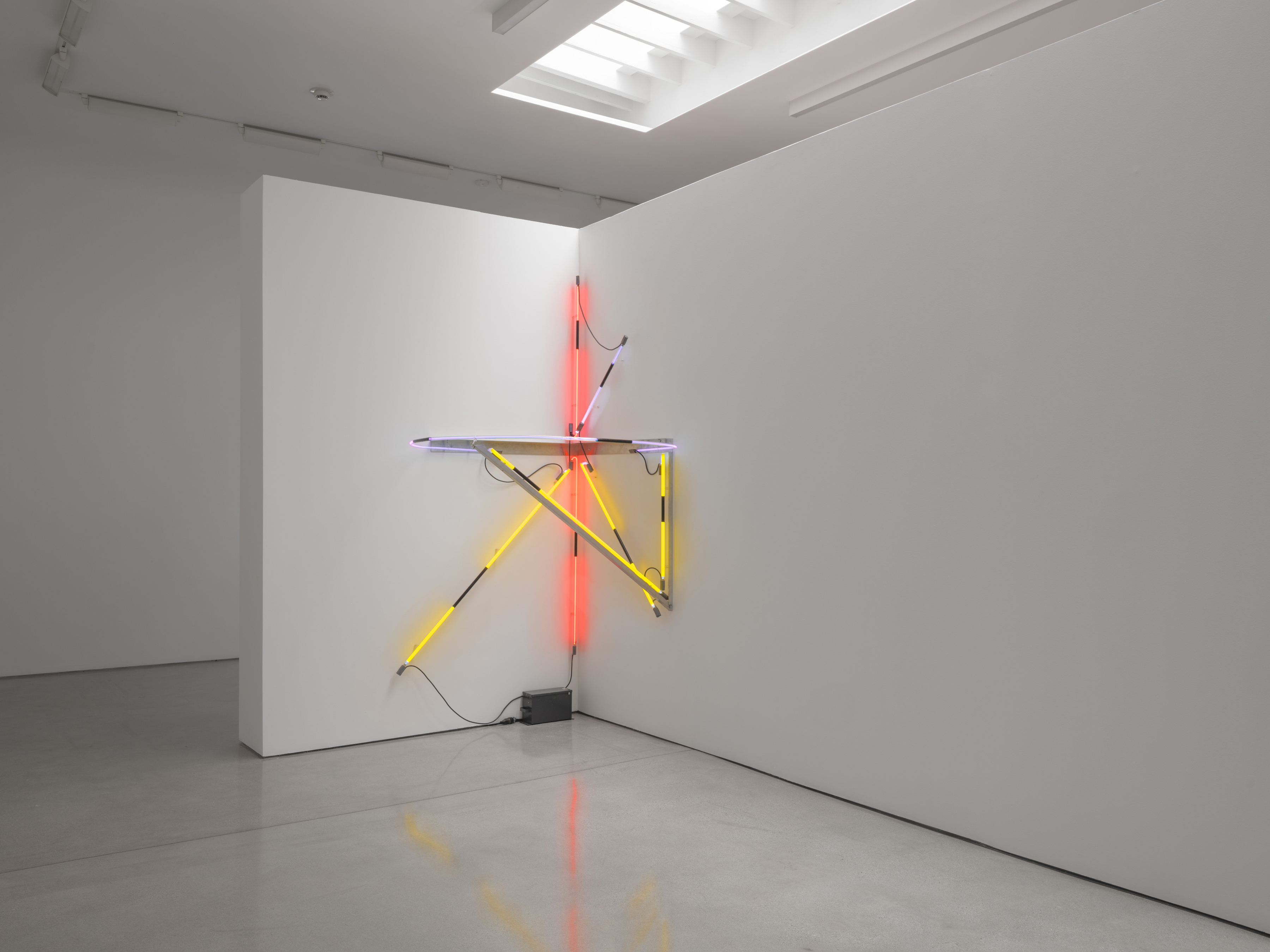 Untitled Neon Corner Piece needs two walls meeting and is given two partition faces at a right angle. The bay closes on it. Image Credit: Installation view. Courtesy Estate of Keith Sonnier and David Kordansky Gallery. Photo: Jeff McLane.