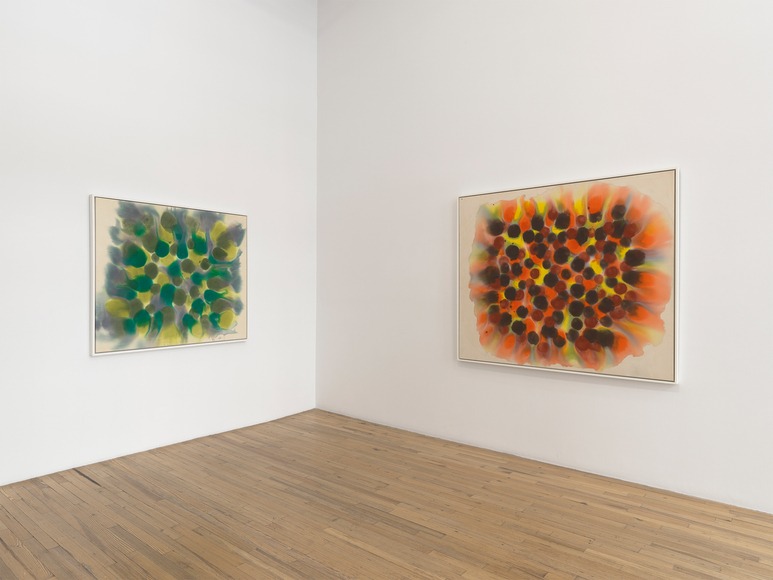 The green and orange paintings meet at the corner, their coloured masses surrounded by exposed canvas. Image Credit: Exhibition view. Courtesy Andrew Kreps Gallery. Photo: Elisabeth Bernstein.