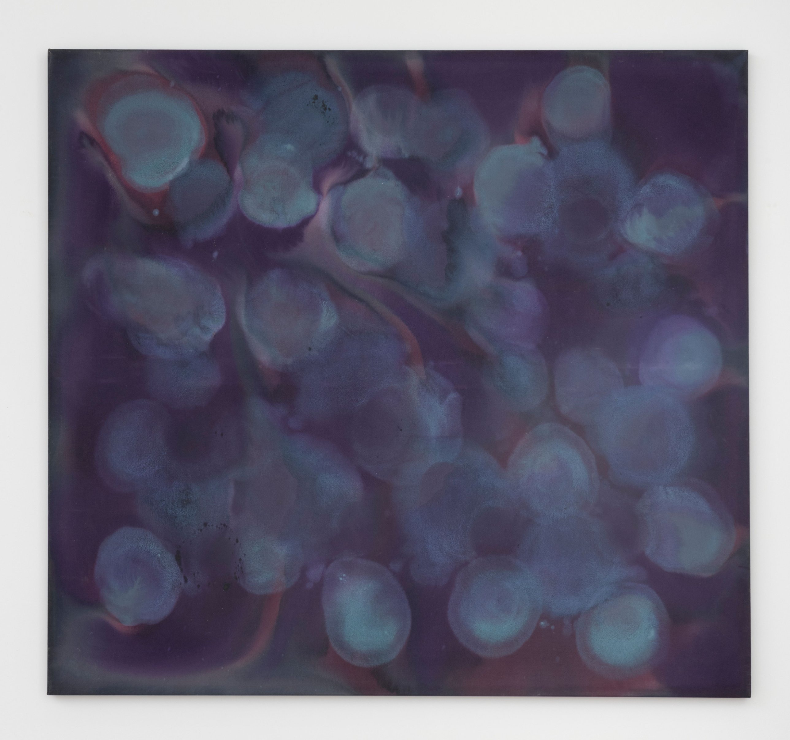 Pale discs overlap within a violet field, darker along the left edge, their concentric rings visible through one another. Image Credit: Untitled, c. 1970. © Kenneth Victor Young. Courtesy Andrew Kreps Gallery, New York.