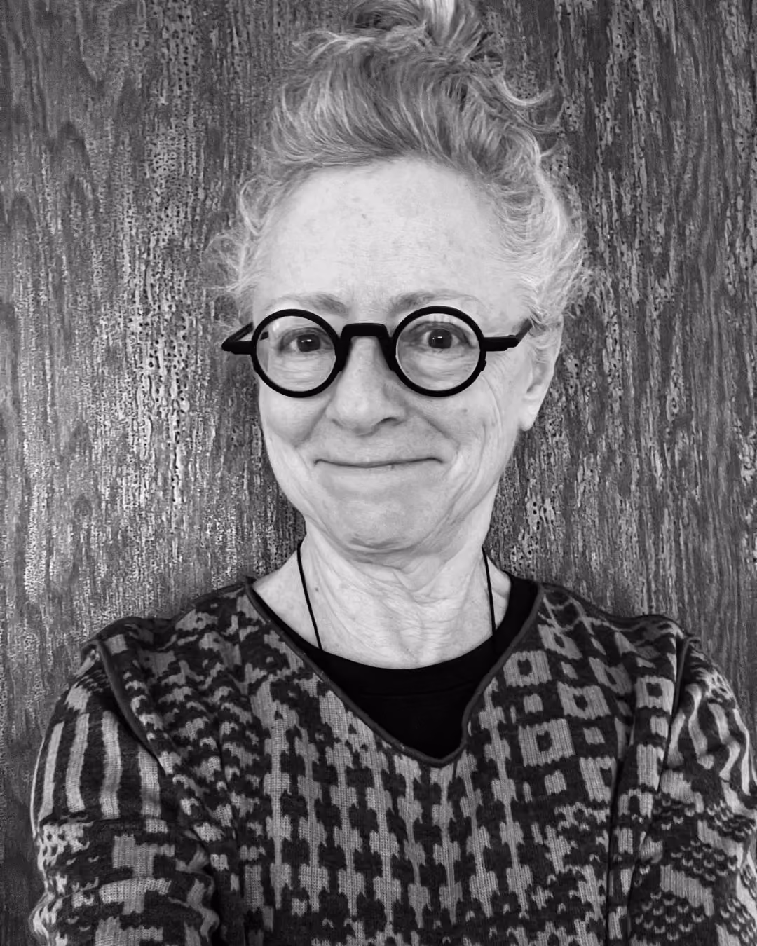 Image of Jan Campanelli; a woman with round rimmed glasses smiling at the camera.