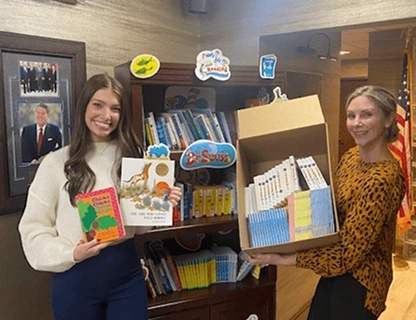RSG volunteering and donating books for kids