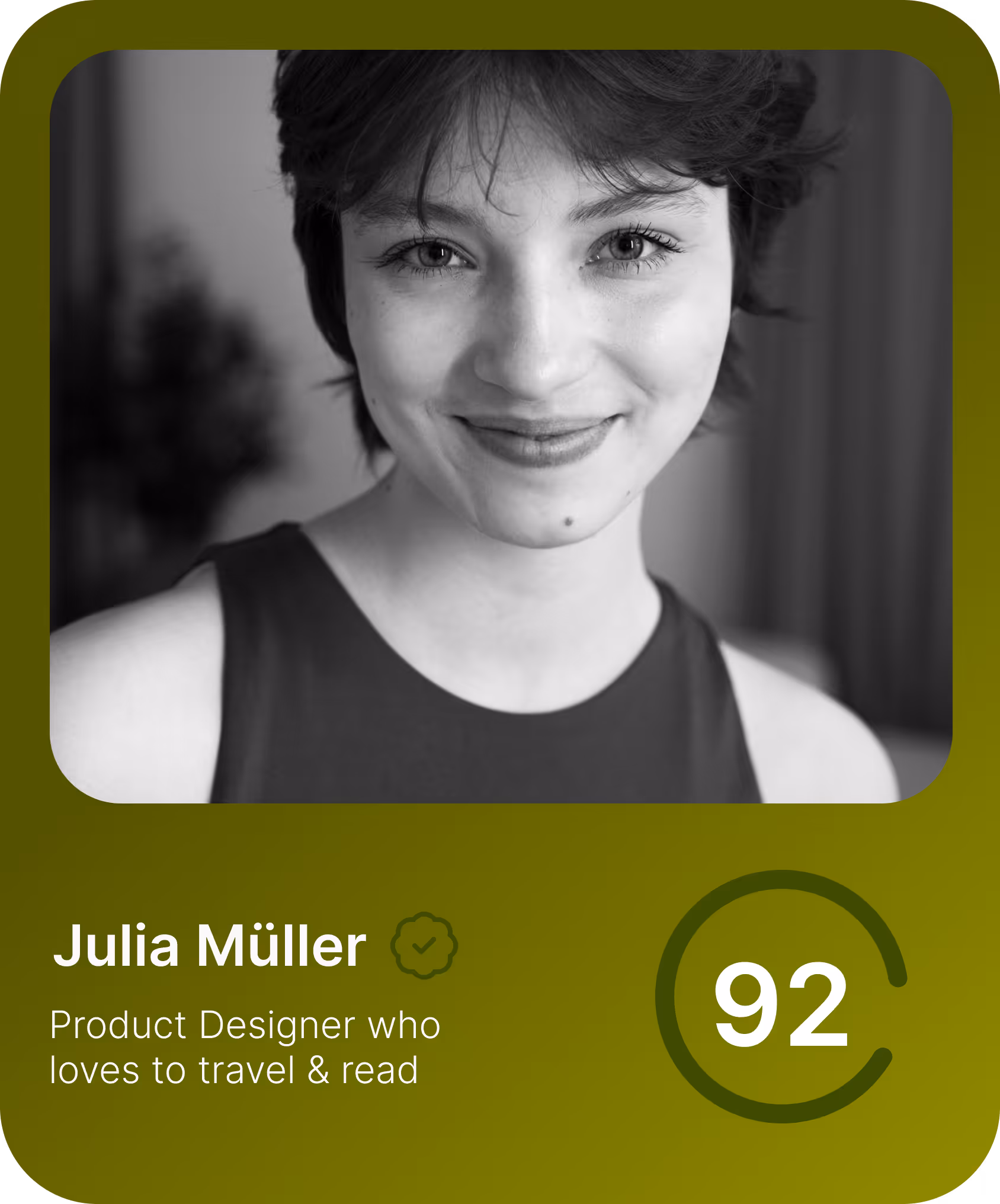 Black and white portrait of a smiling woman with short hair, wearing a sleeveless top.