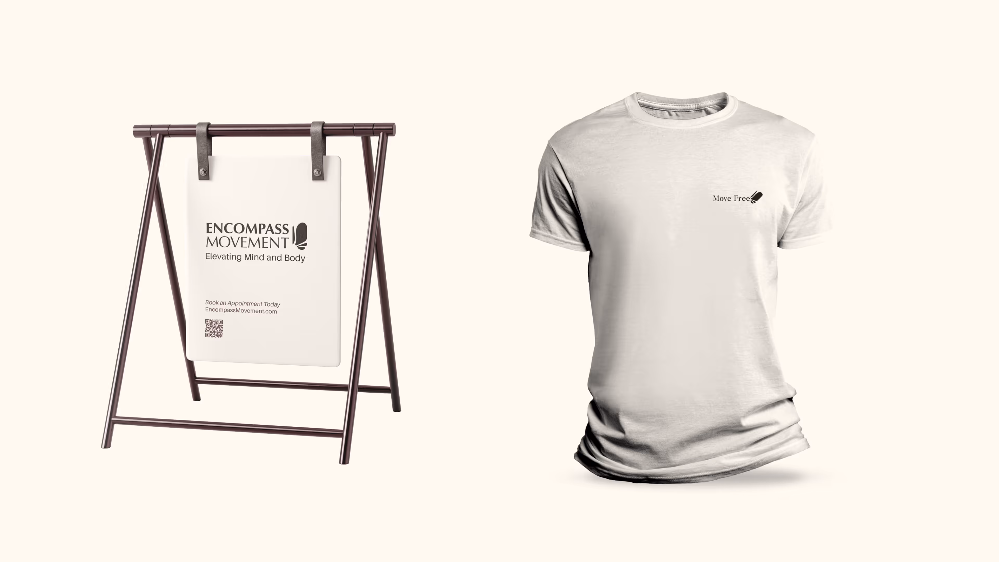 White sign on brown metal stand with Encompass Movement logo and website, next to white t-shirt with small 'Move Free' logo on chest.
