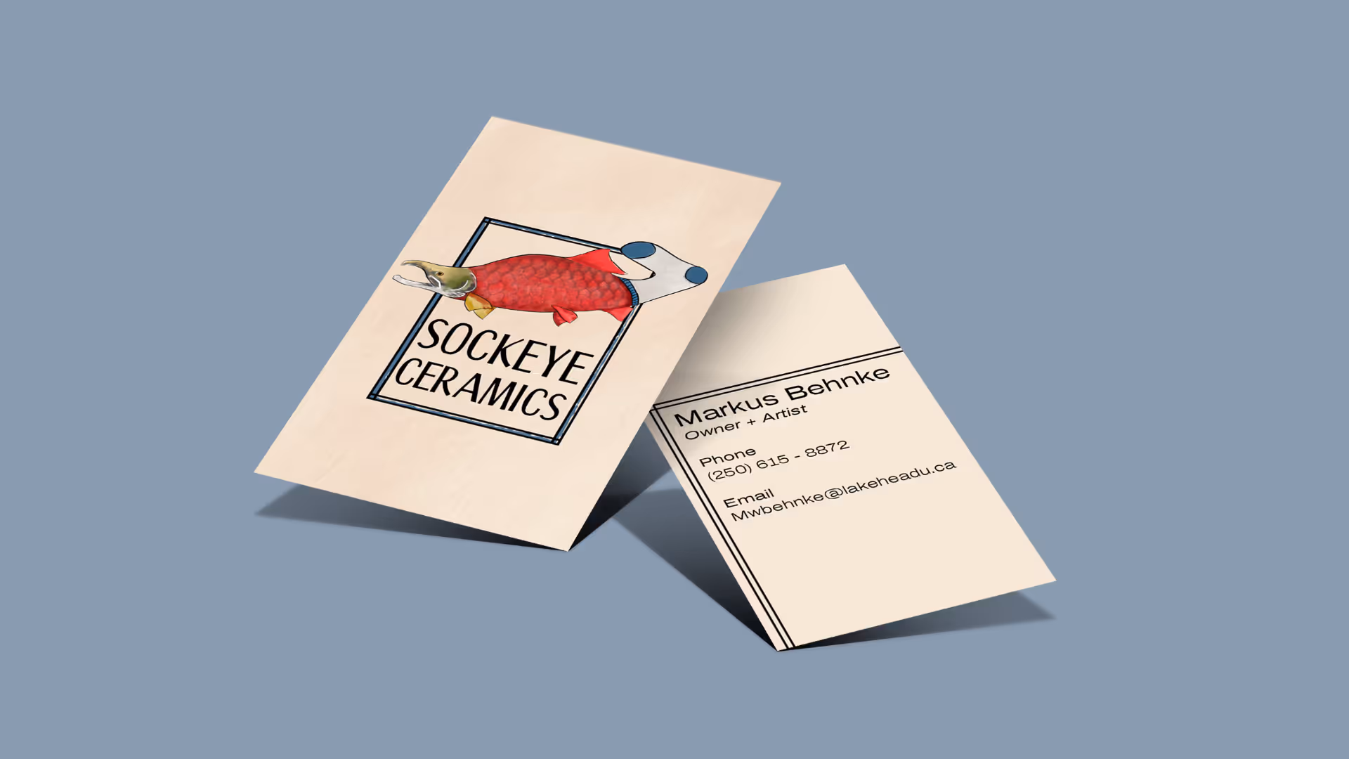 Invoice, business cards, and pen on brown surface for Black Rose Cakery showing contact details and cake order.