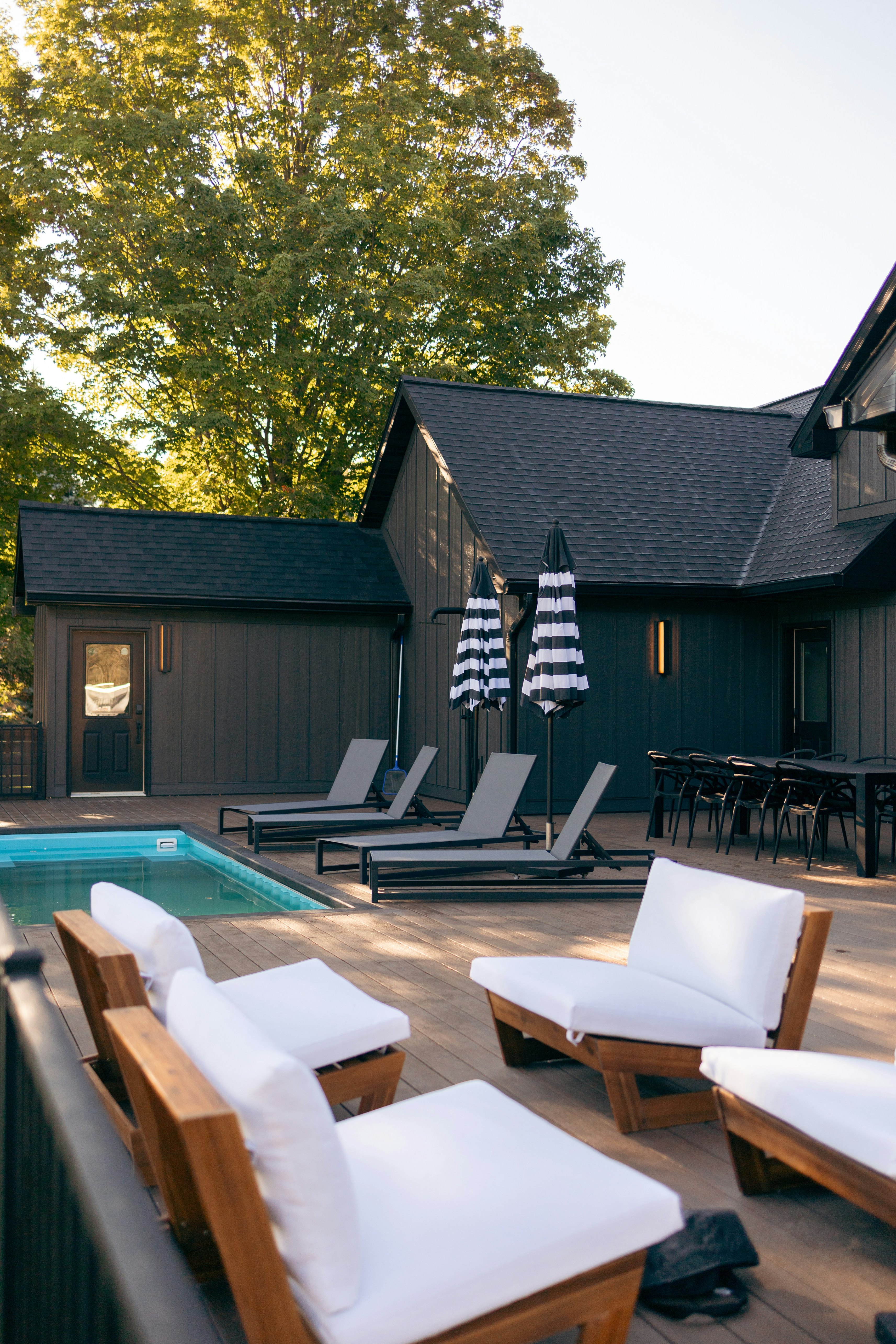 Pool and deck behind a modern home
