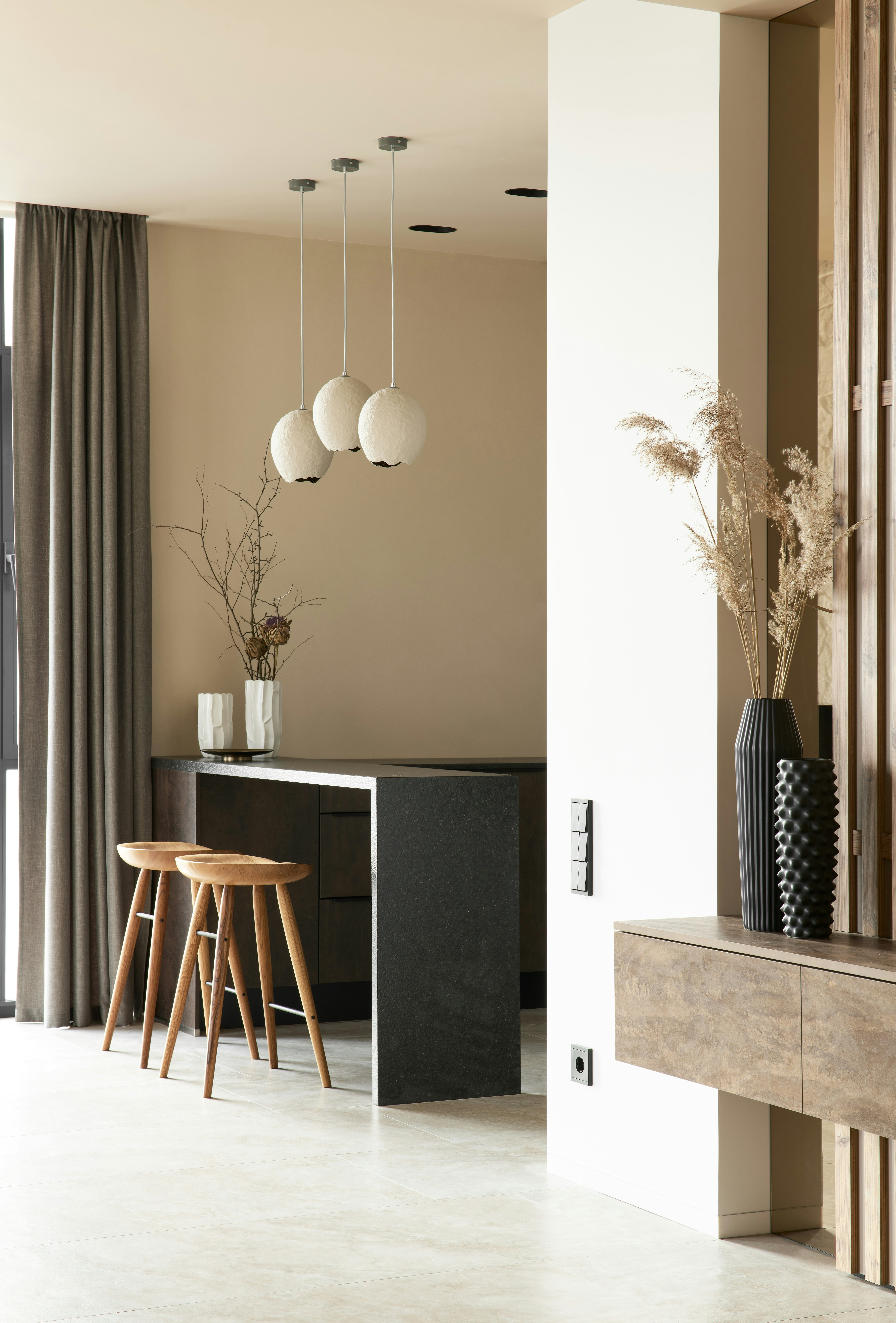 Kitchen counter with stools and pendant lights