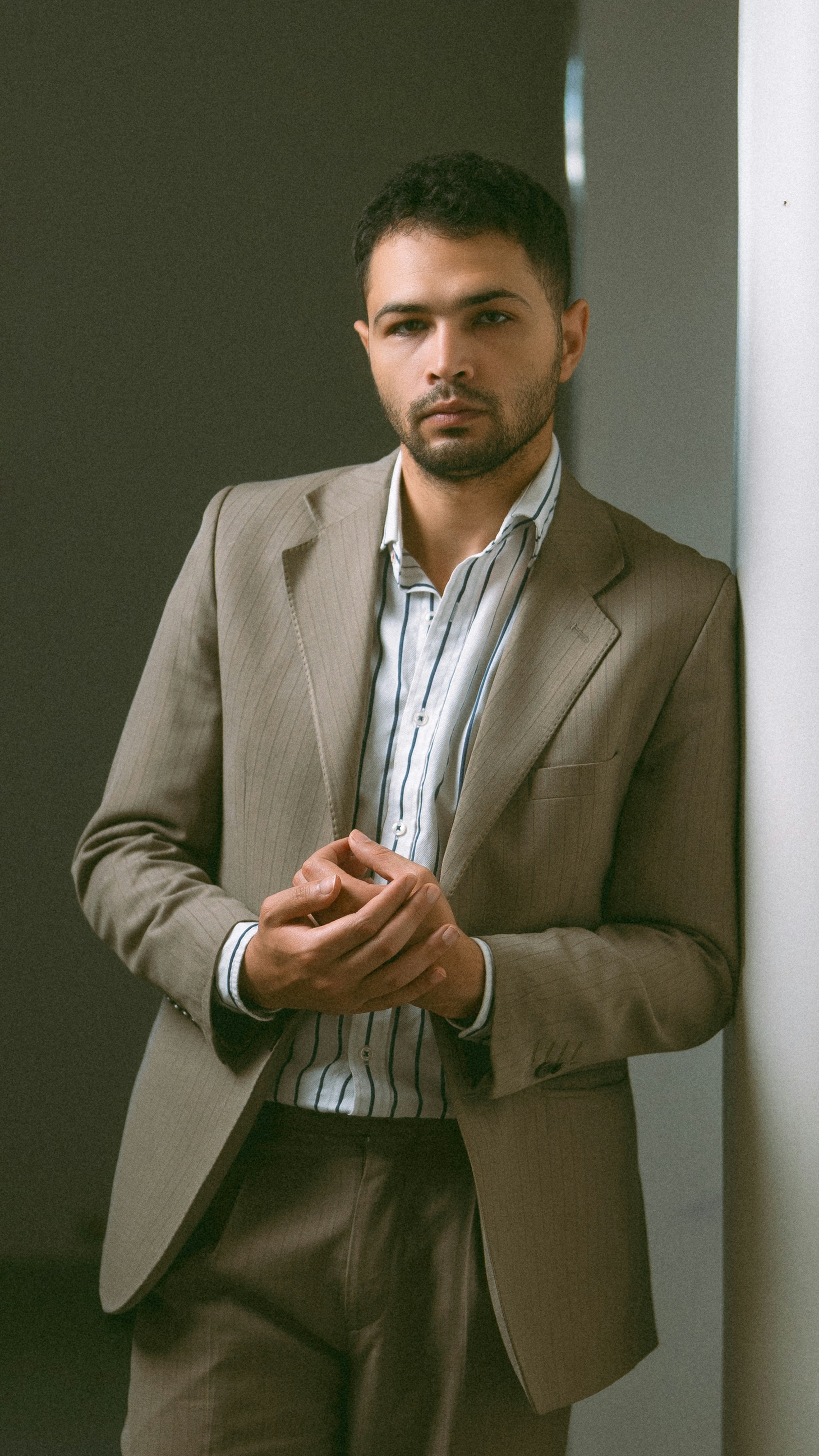 Editorial portrait in a tan suit