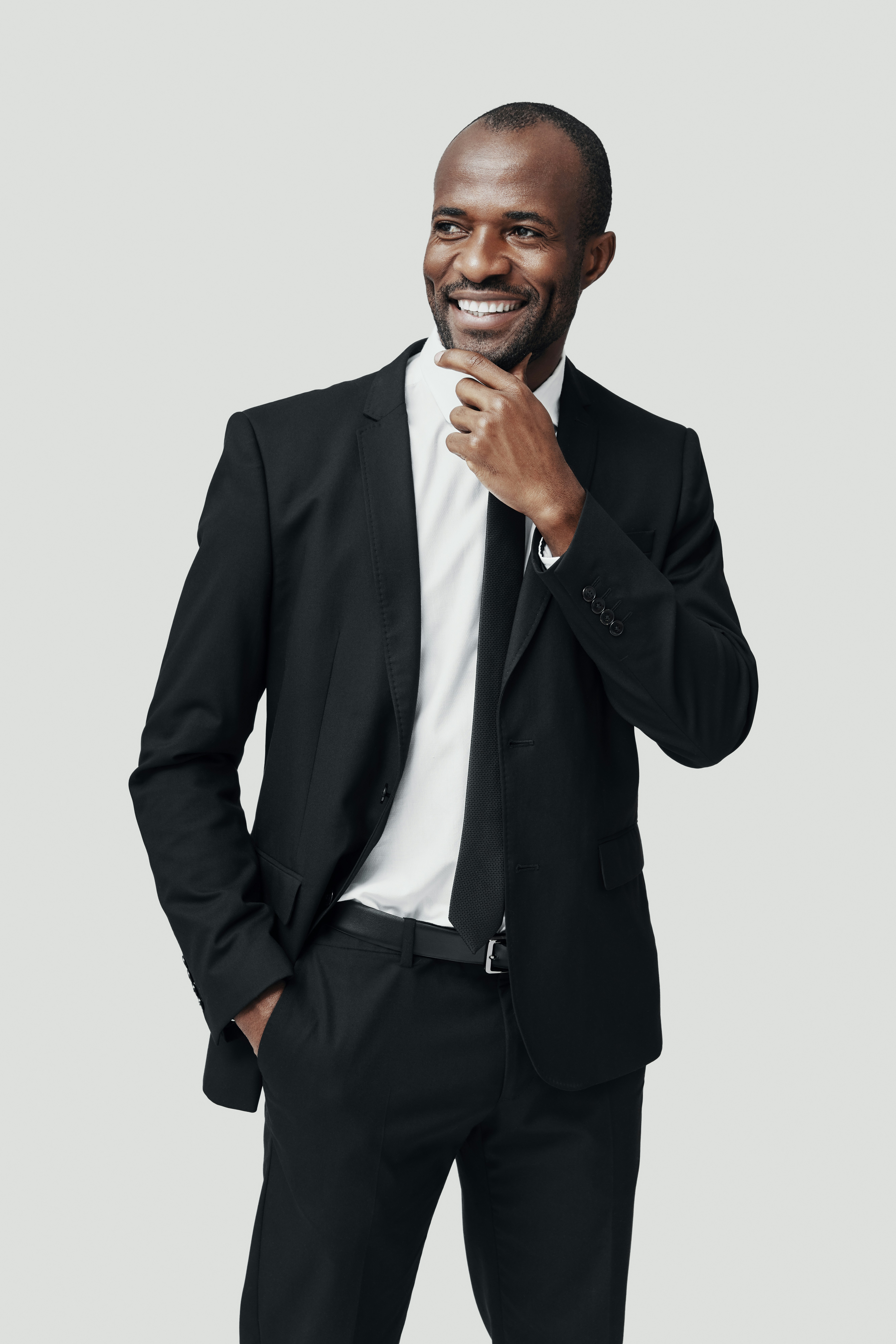 Studio portrait of an agent in a black suit