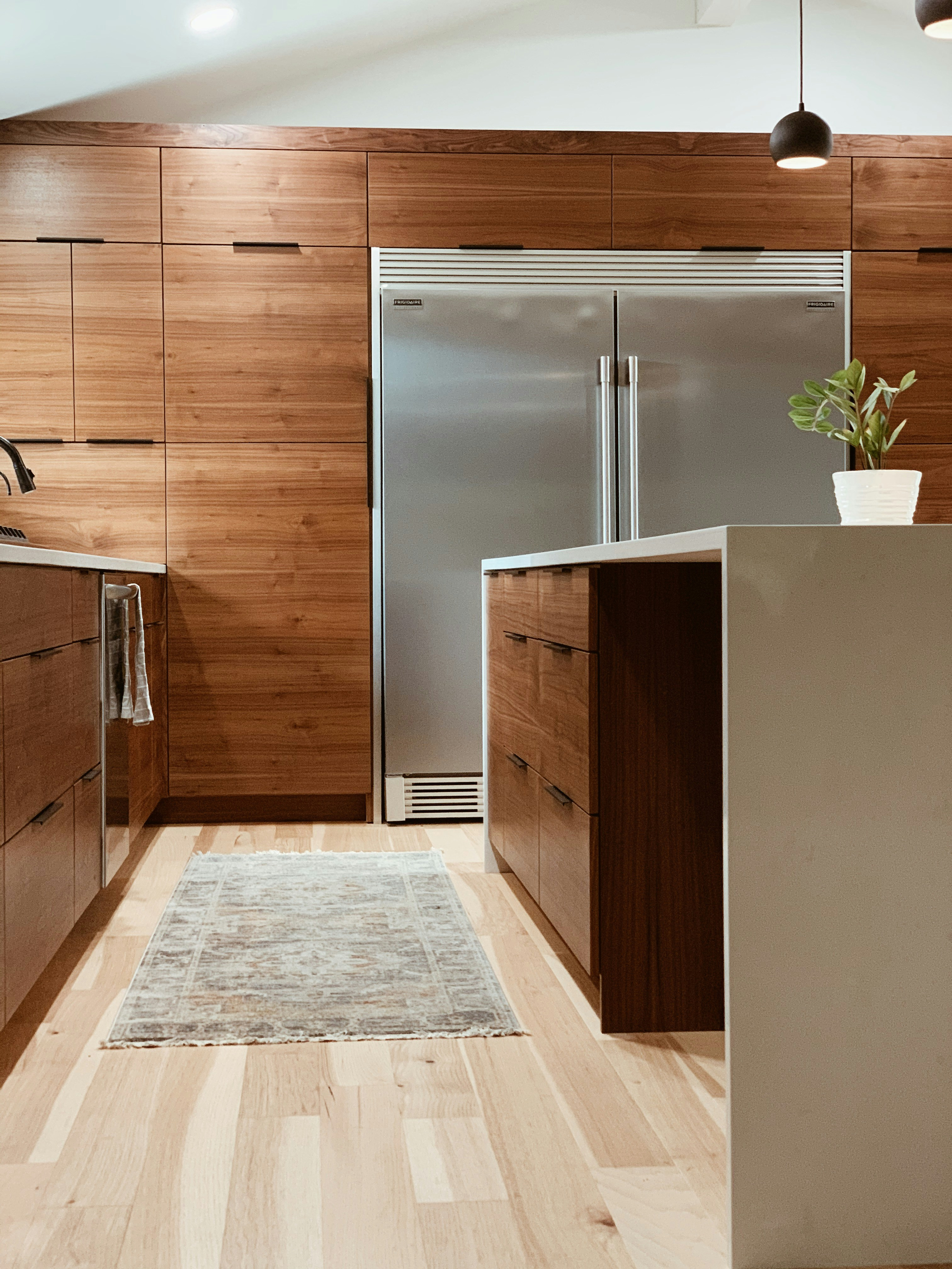Walnut kitchen with a waterfall island