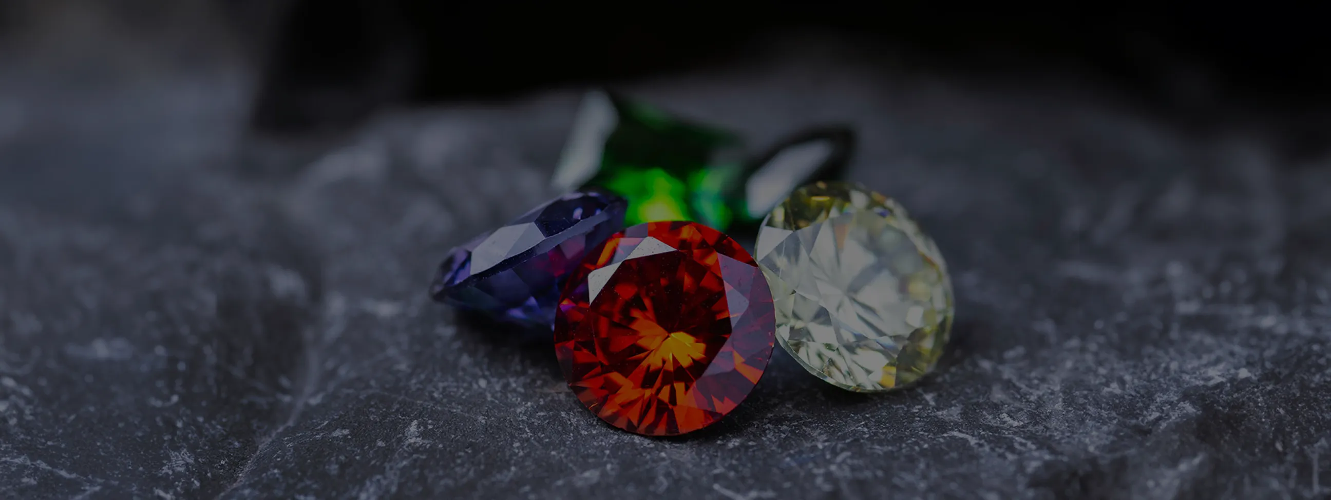 Natural gemstones on a dark surface