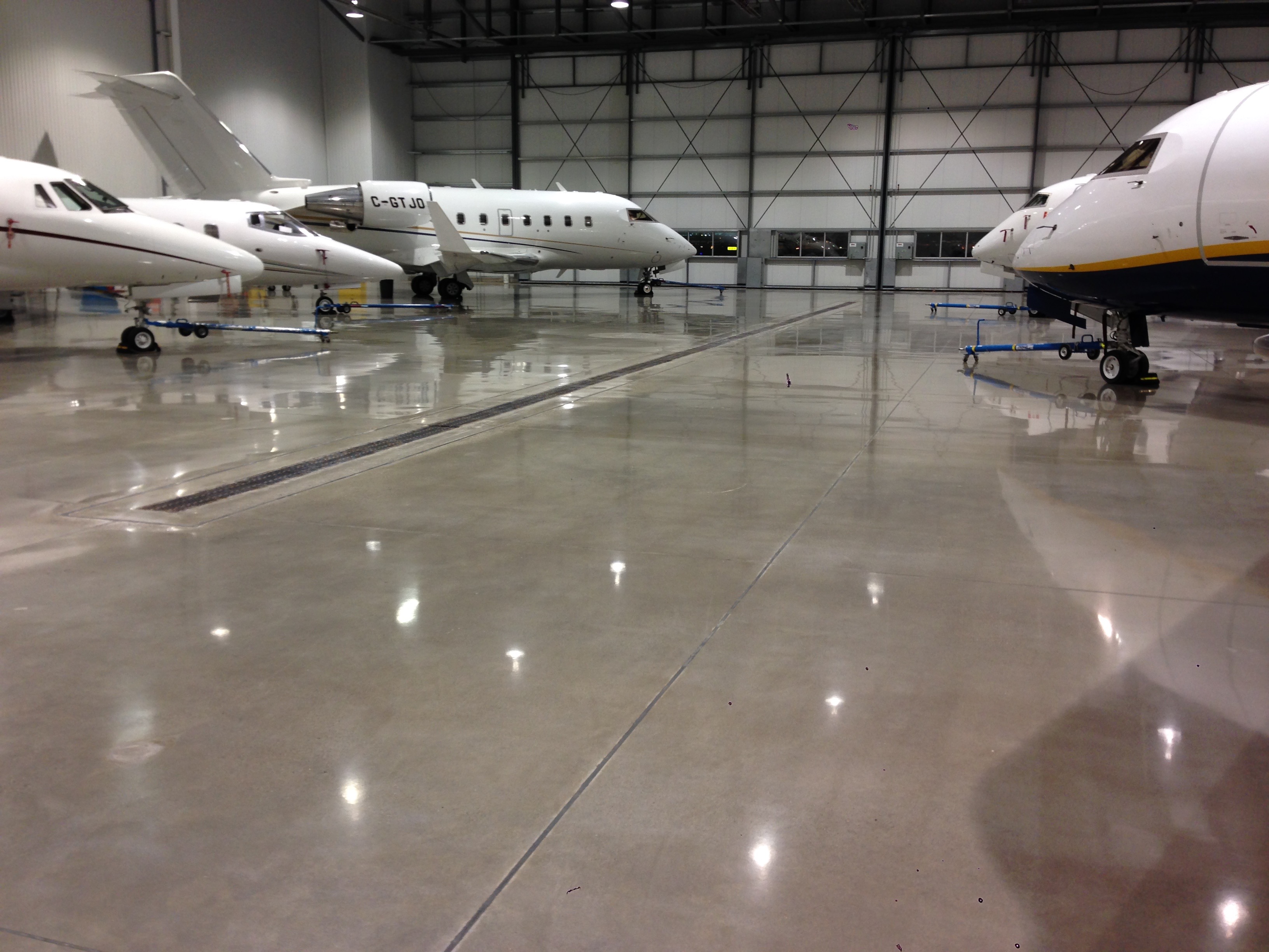 Polished hangar floor with business jets