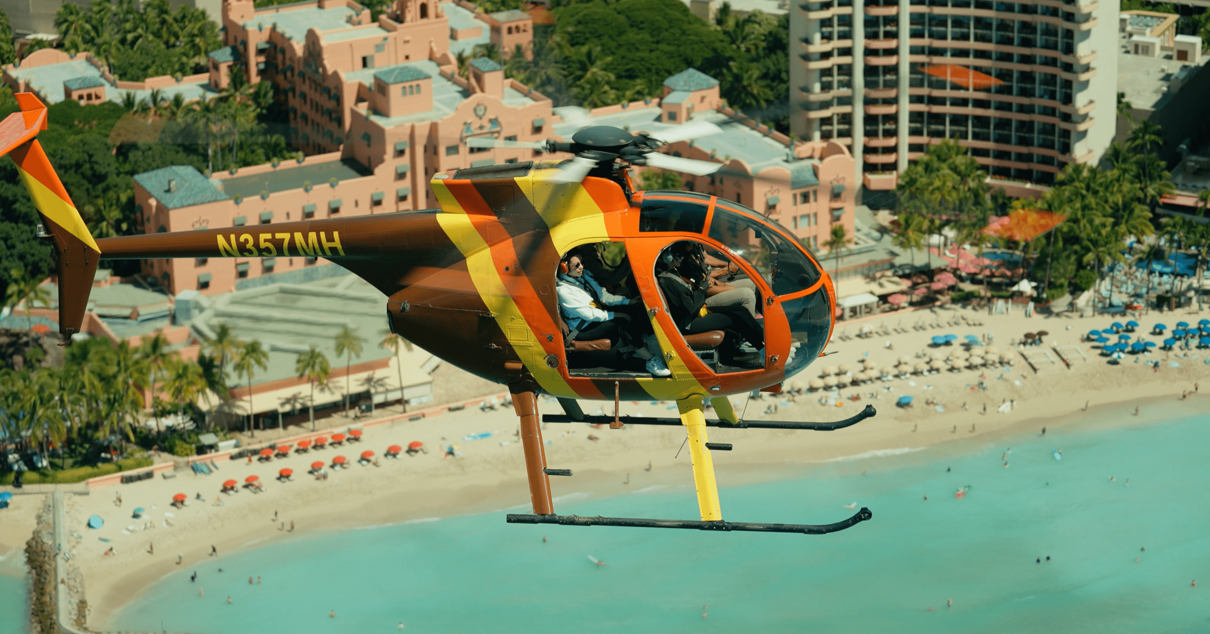 Helicopter flying over Waikiki Beach and Honolulu skyline