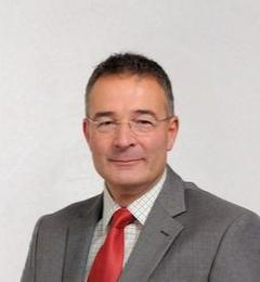 Headshot of a investment committee member.