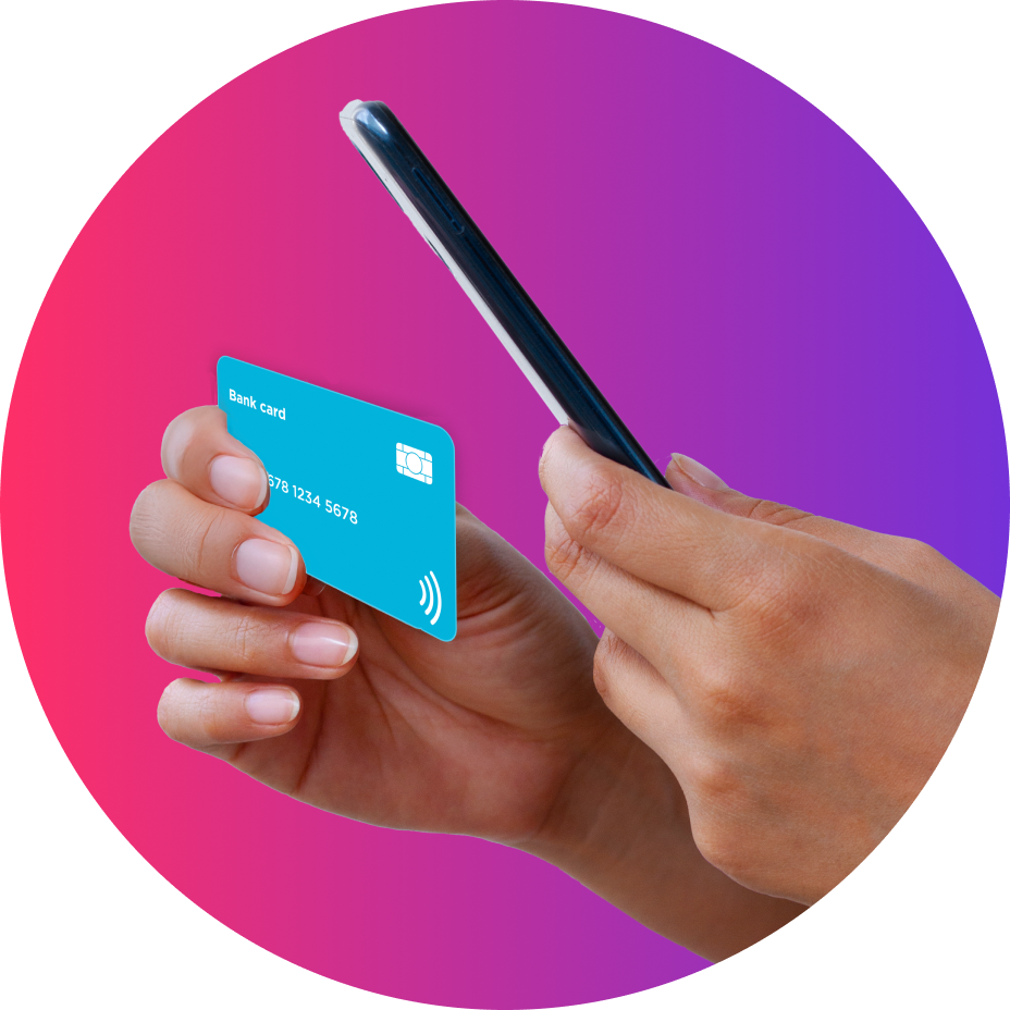 Hand holding a blue bank card and a smartphone against a pink and purple gradient background.
