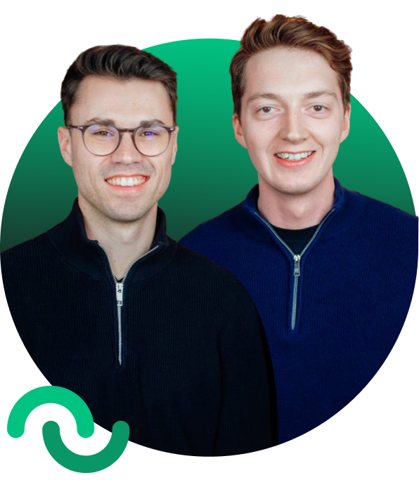 Two smiling young men wearing zip-up sweaters, one with glasses and dark hair, the other with light brown hair, standing in front of a green circular gradient background.