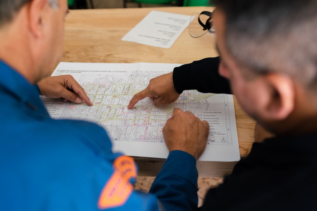 Homeowner reviewing HVAC documentation and permit requirements Homeowner reviewing HVAC documentation and permit requirements