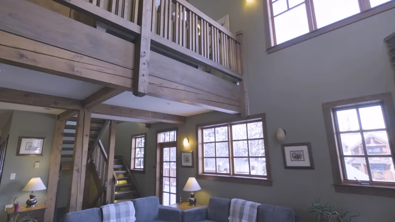 Timber loft and tall windows above the shared lounge