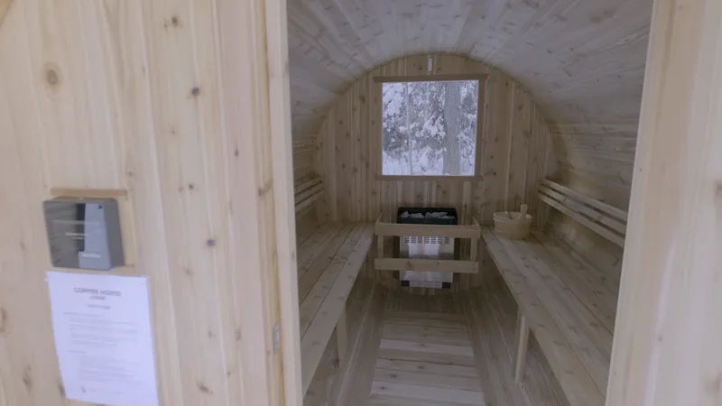 Open doorway into the cedar barrel sauna