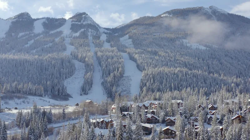 Snow-covered resort village beneath the Kicking Horse ski mountain