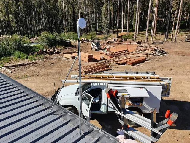 image of a technician installing solar panels