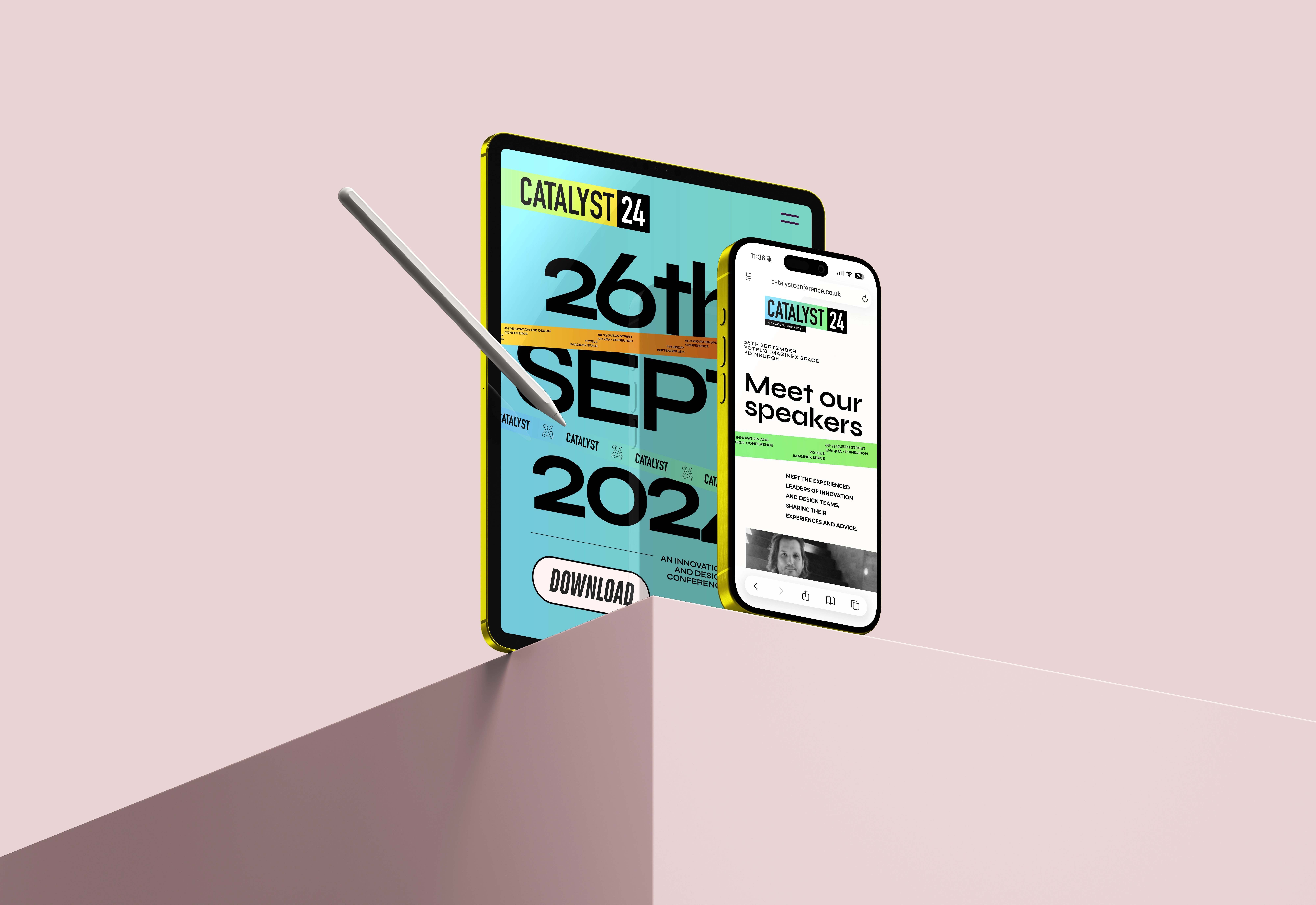 Tablet and smartphone displaying Catalyst 24 event details with a stylus pointing at the tablet screen on a pink surface.