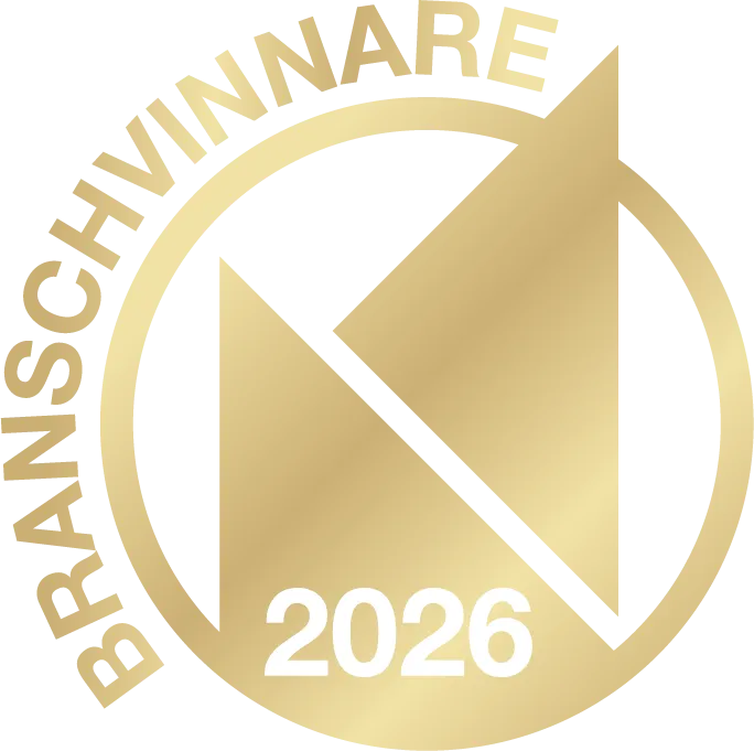 Gold circular emblem with stylized geometric shapes inside and the text 'BRANSCHVINNARE 2026' around the edge and bottom.