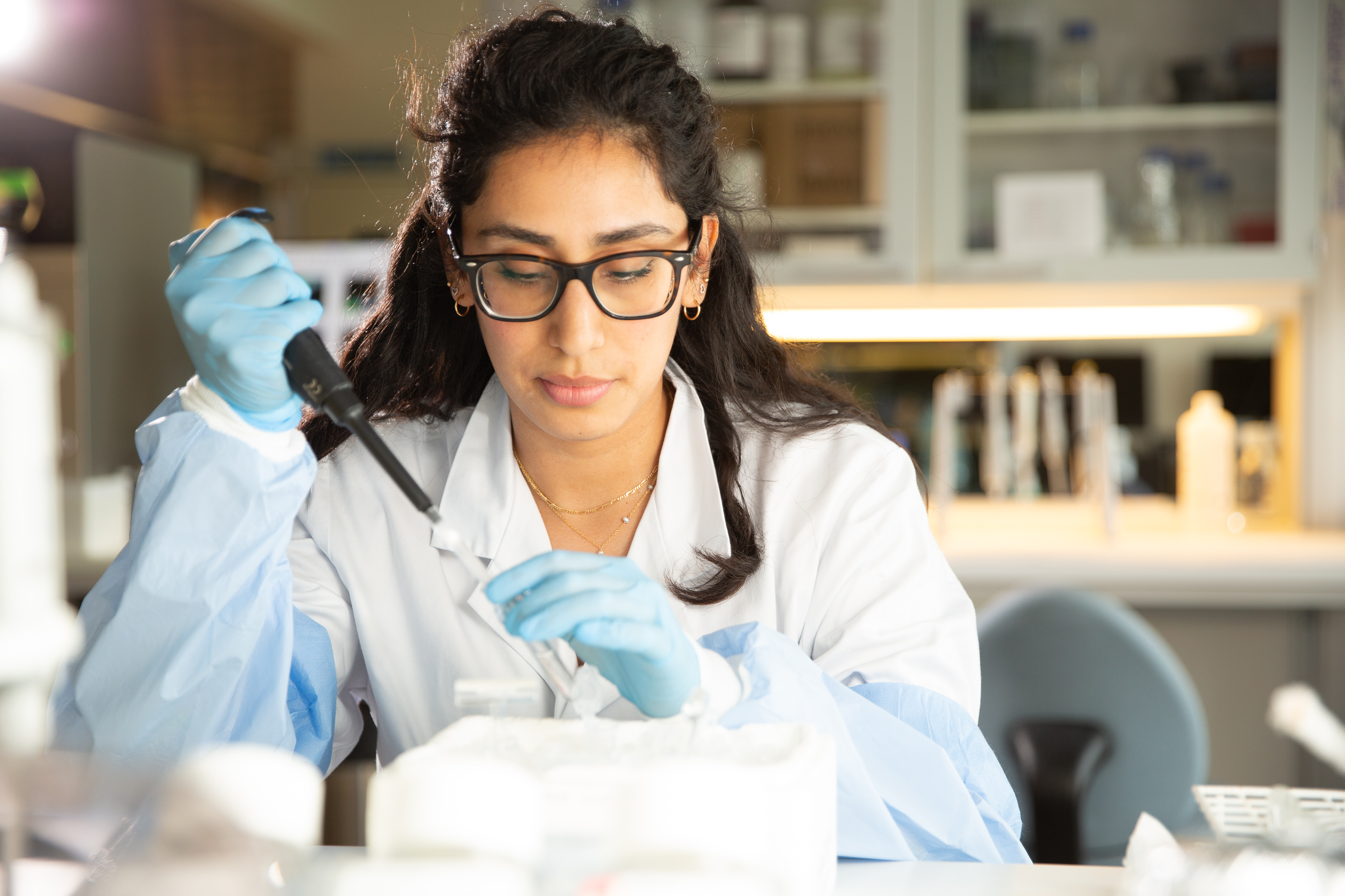 Nocteva scientist pipetting in the laboratory
