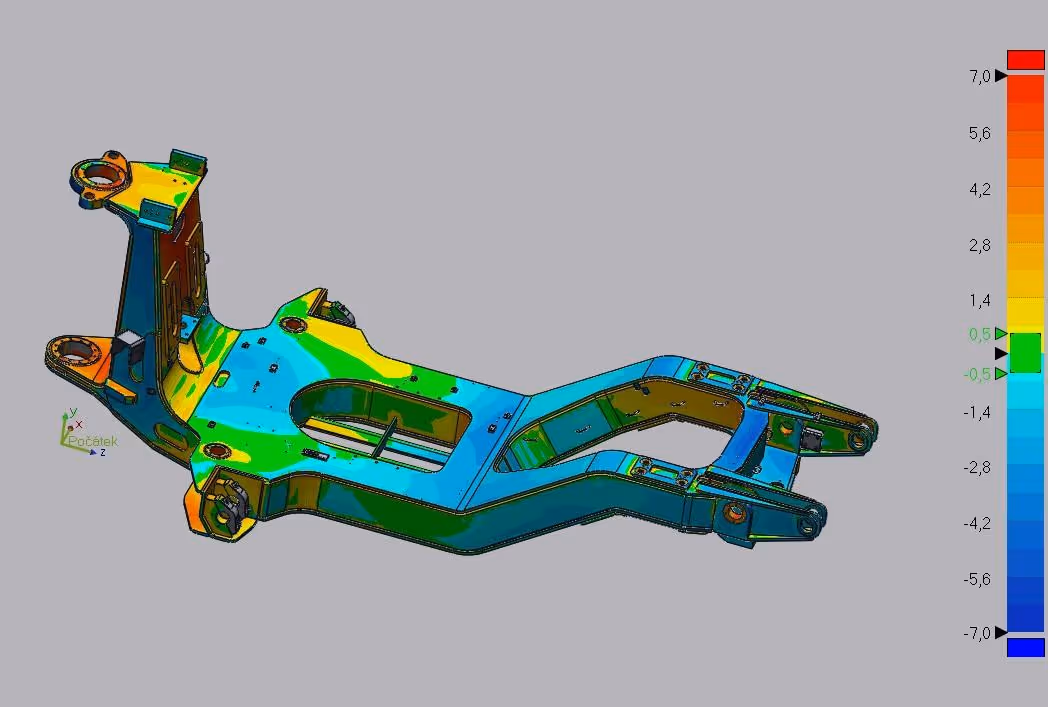 A series of large metal gears with shafts, located in an industrial workshop on the floor.