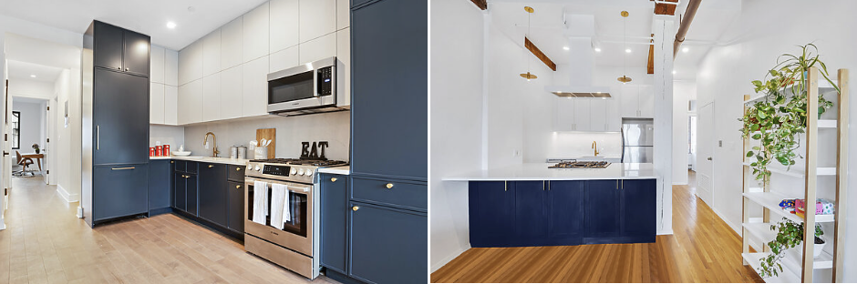 Modern kitchen with navy blue lower cabinets, white upper cabinets, wooden floor, stainless steel appliances, and green plants on a white shelving unit.