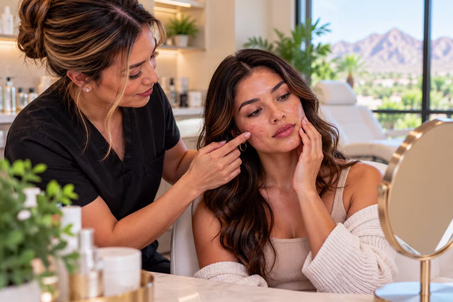Medical provider examining a patient's skin at an aesthetic clinic in Gilbert, Arizona