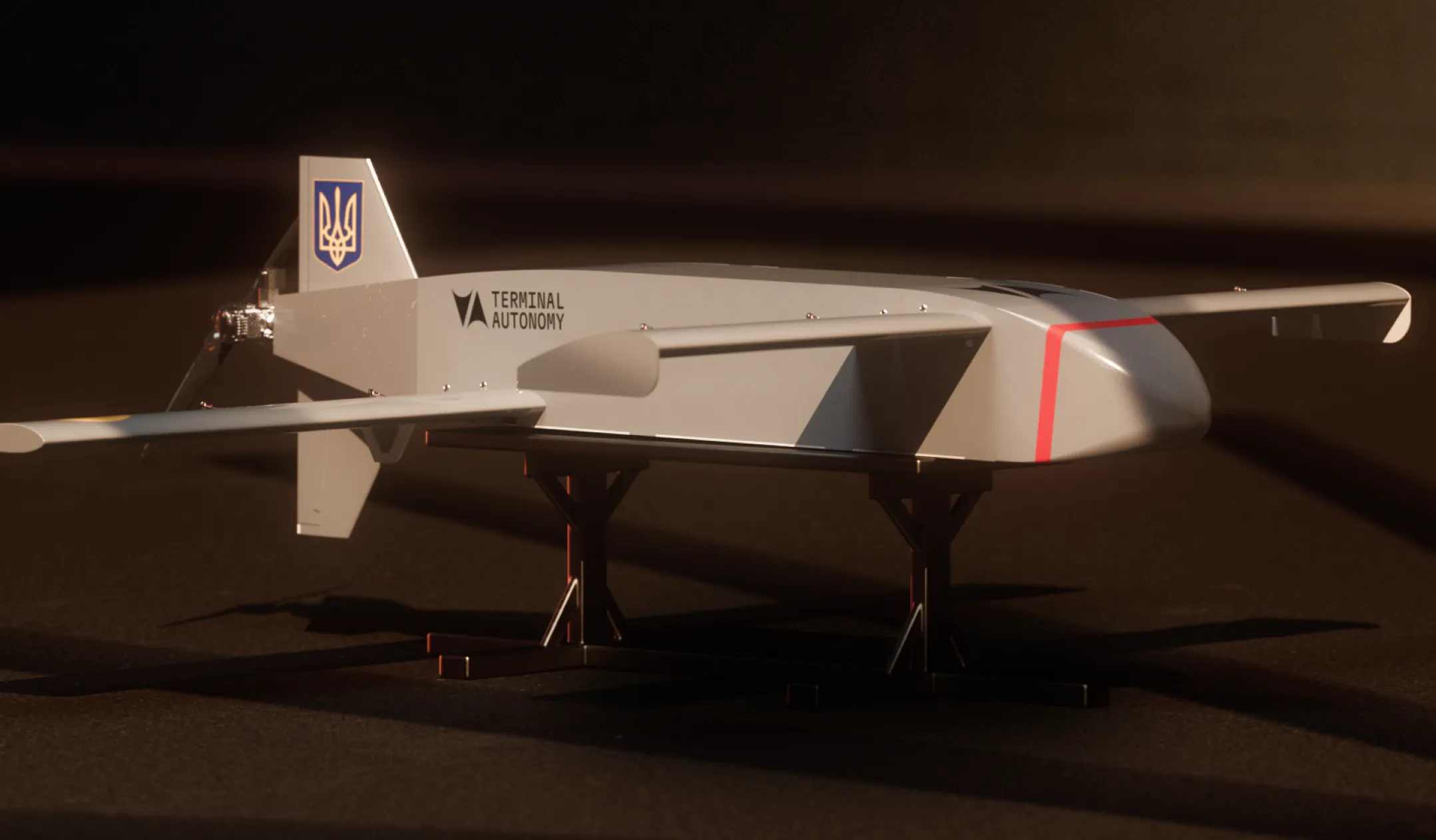 White drone with 'Terminal Autonomy' logo and Ukrainian emblem on tail, mounted on black stand against dark background.