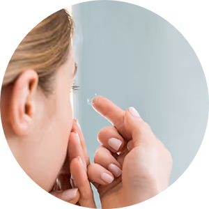 A woman with a pimple on her face.