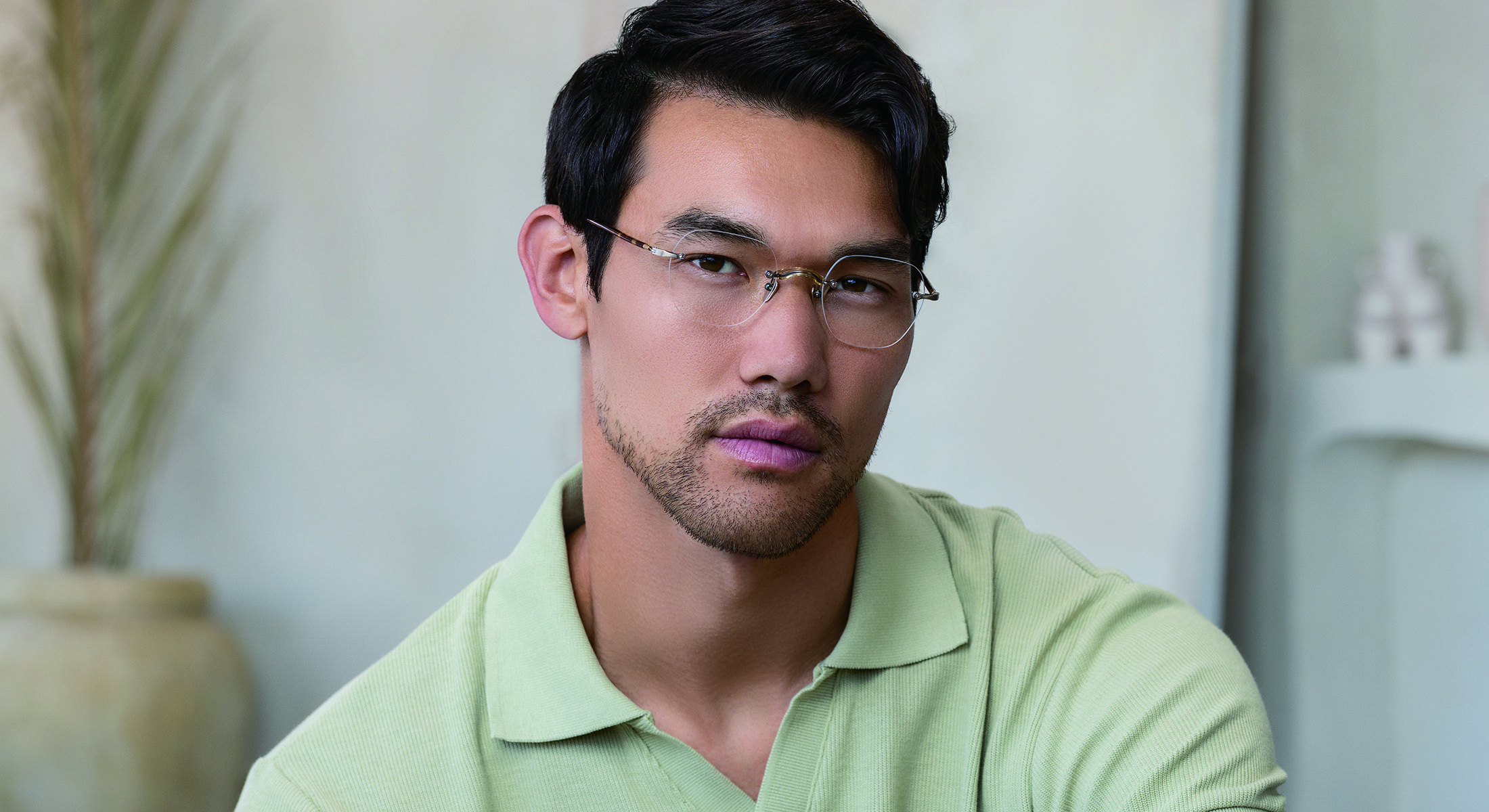 A man wearing Masunaga frames