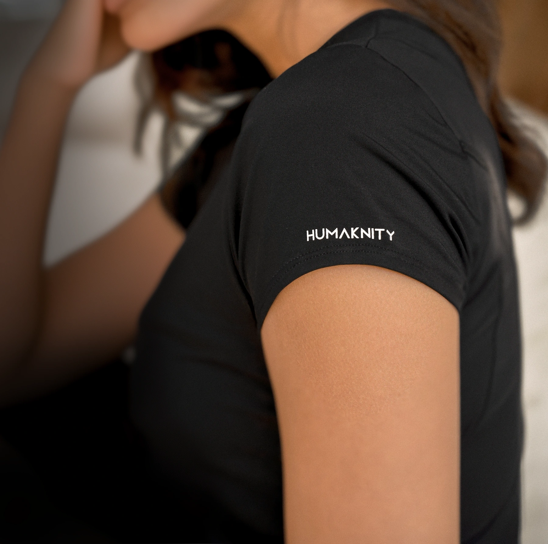 Pregnant woman wearing HUMAKNITY's clothing