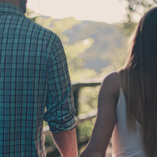 Couple on a bridge holding hands