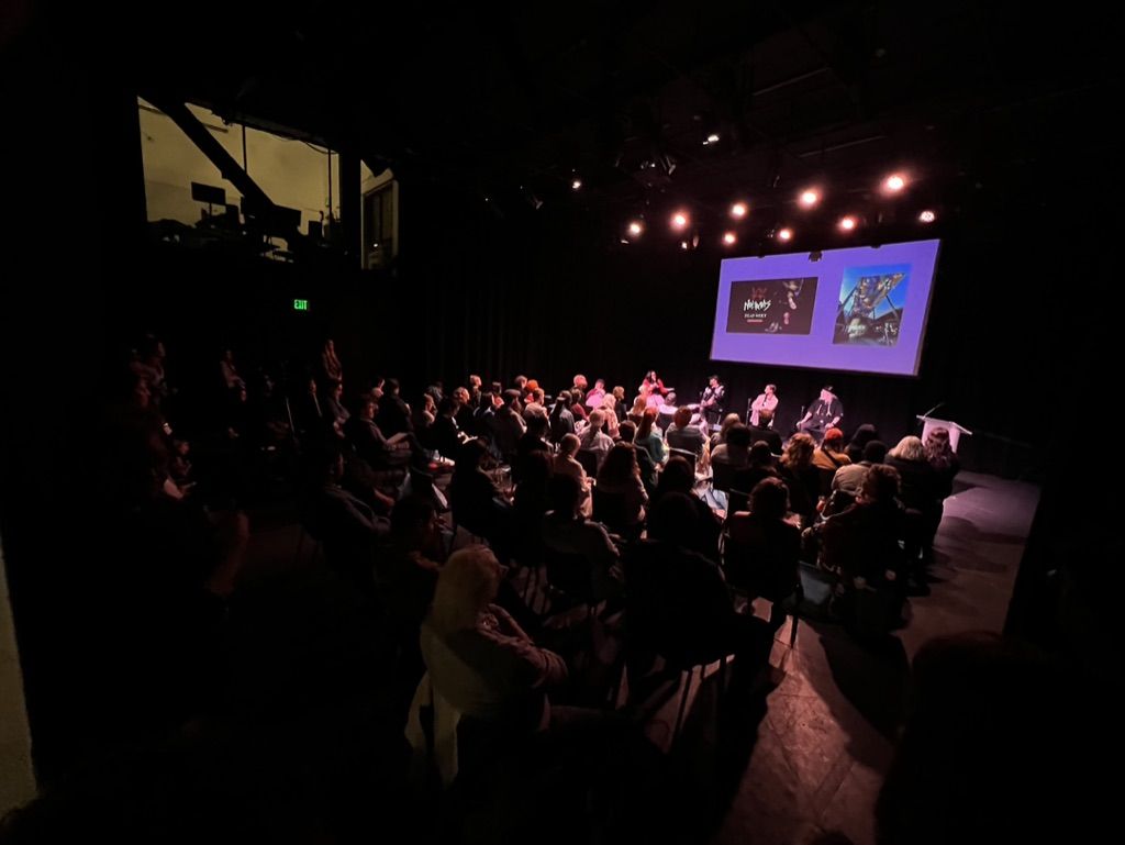 Art Boost conference stage and audience