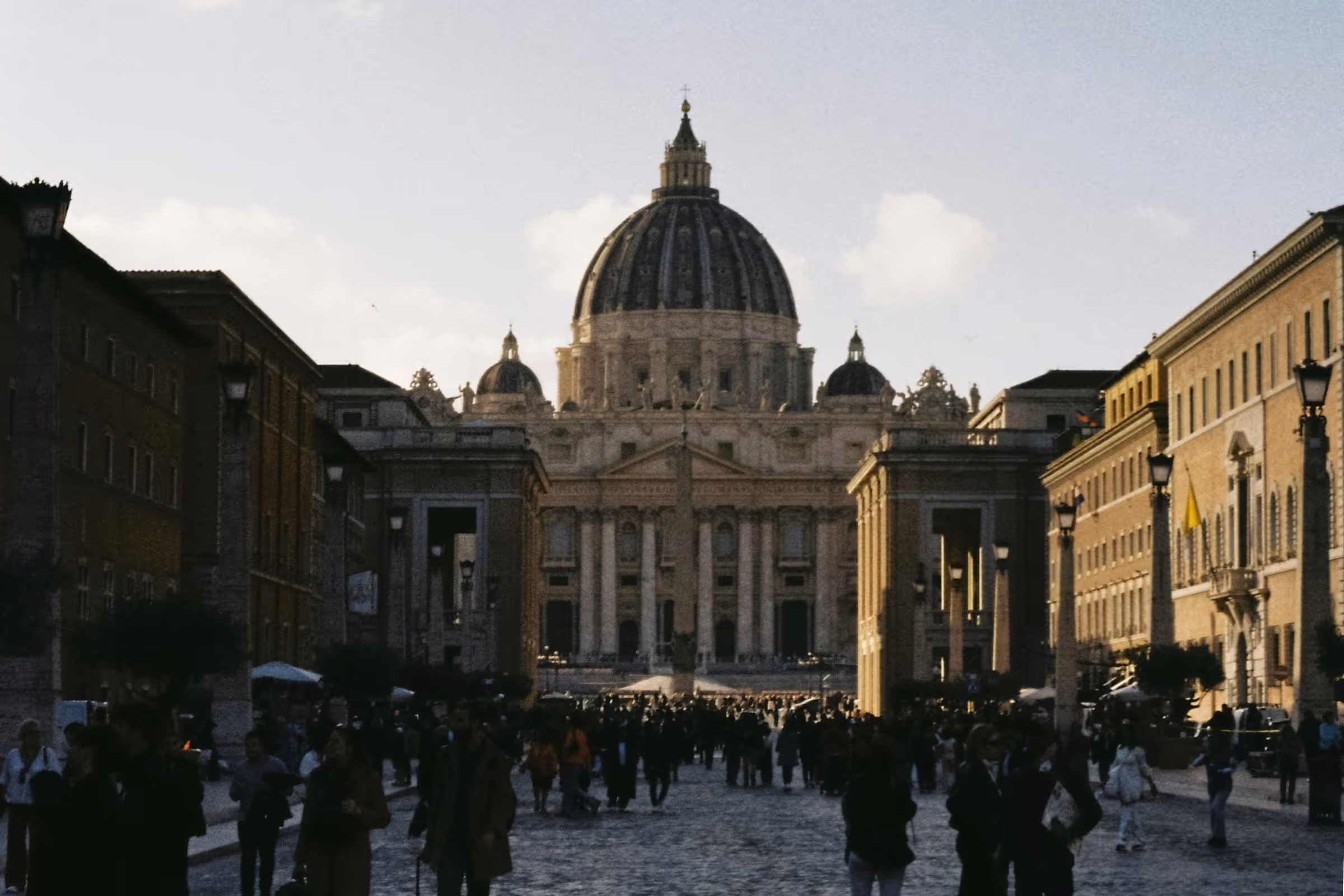 St. Peter's Basilica in the background with crowds of people in the foreground