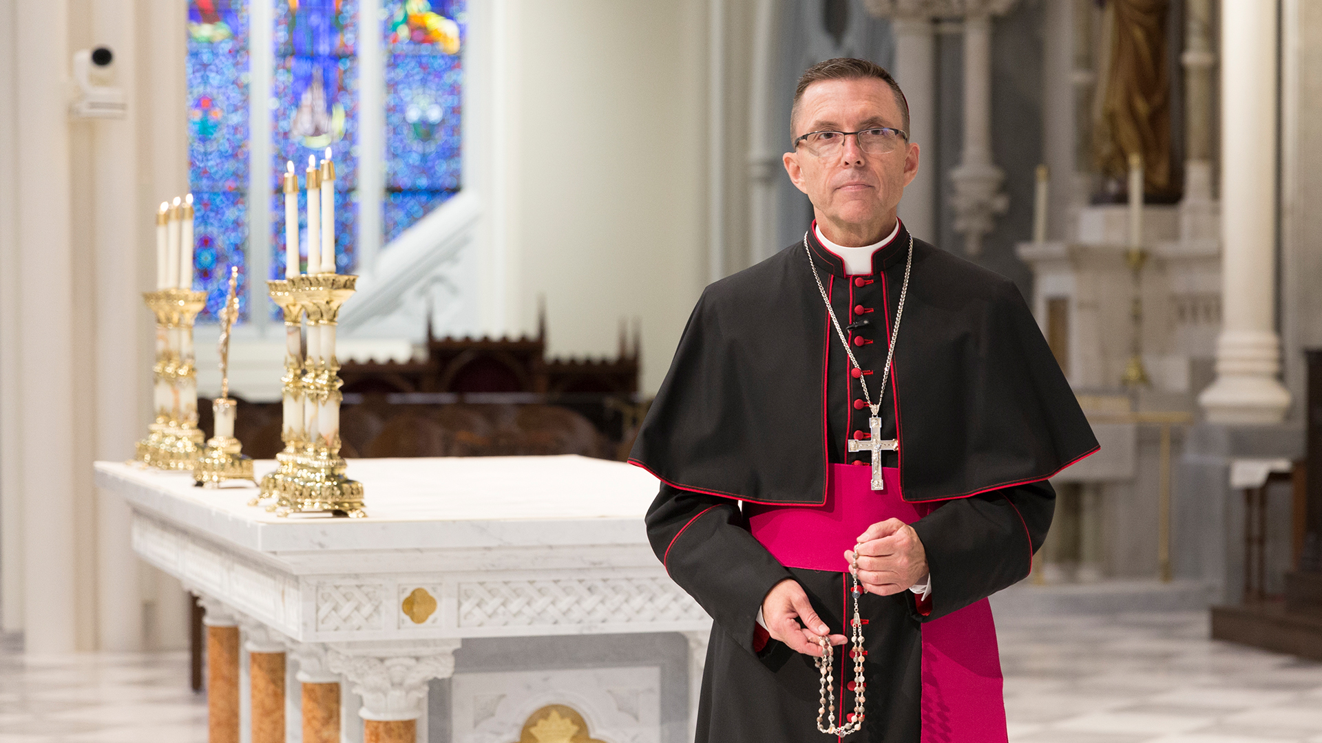 Bishop Robert Reed with rosary beads